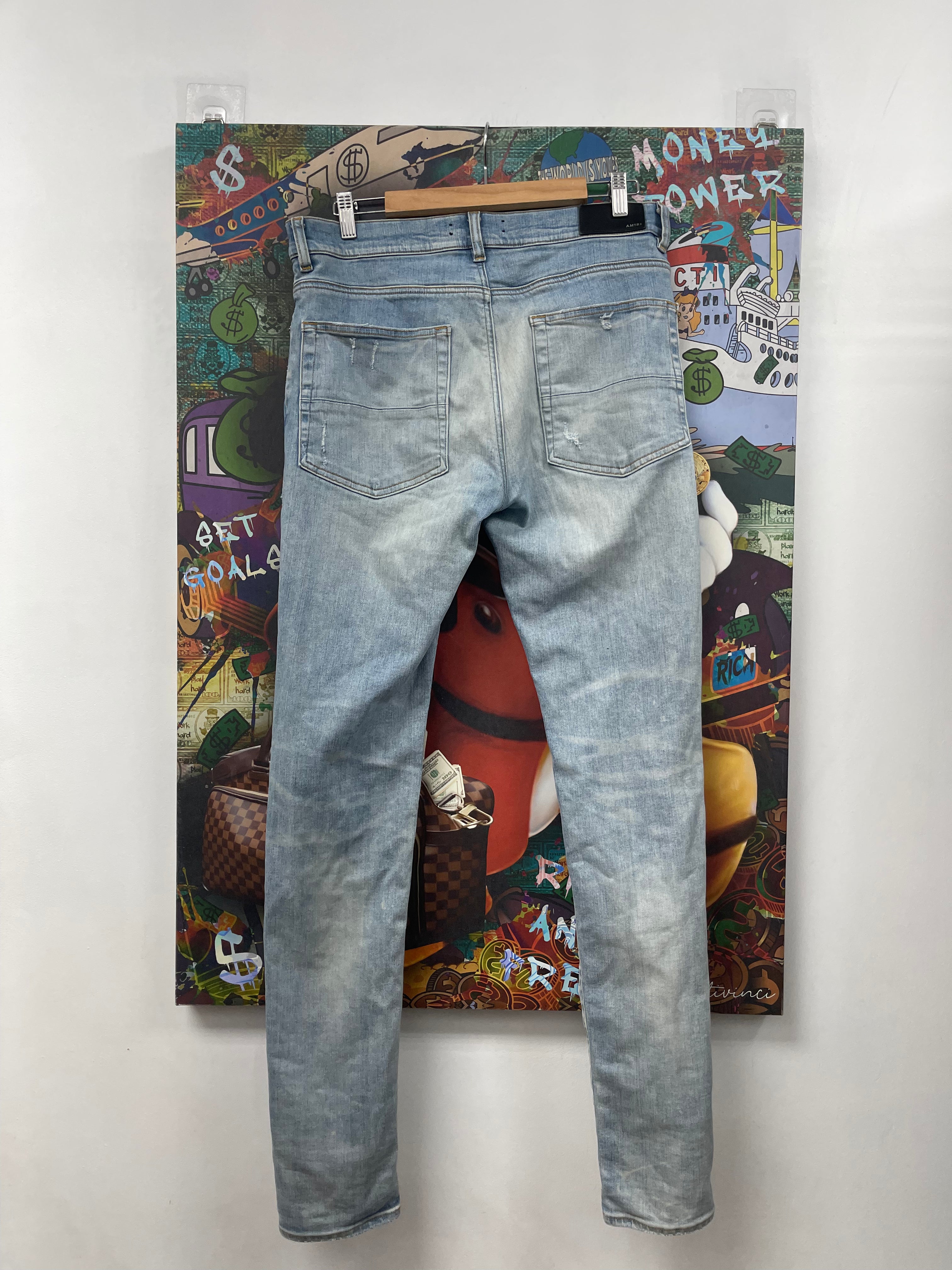 Amiri MX1 Light Wash White Suede Patch Jeans