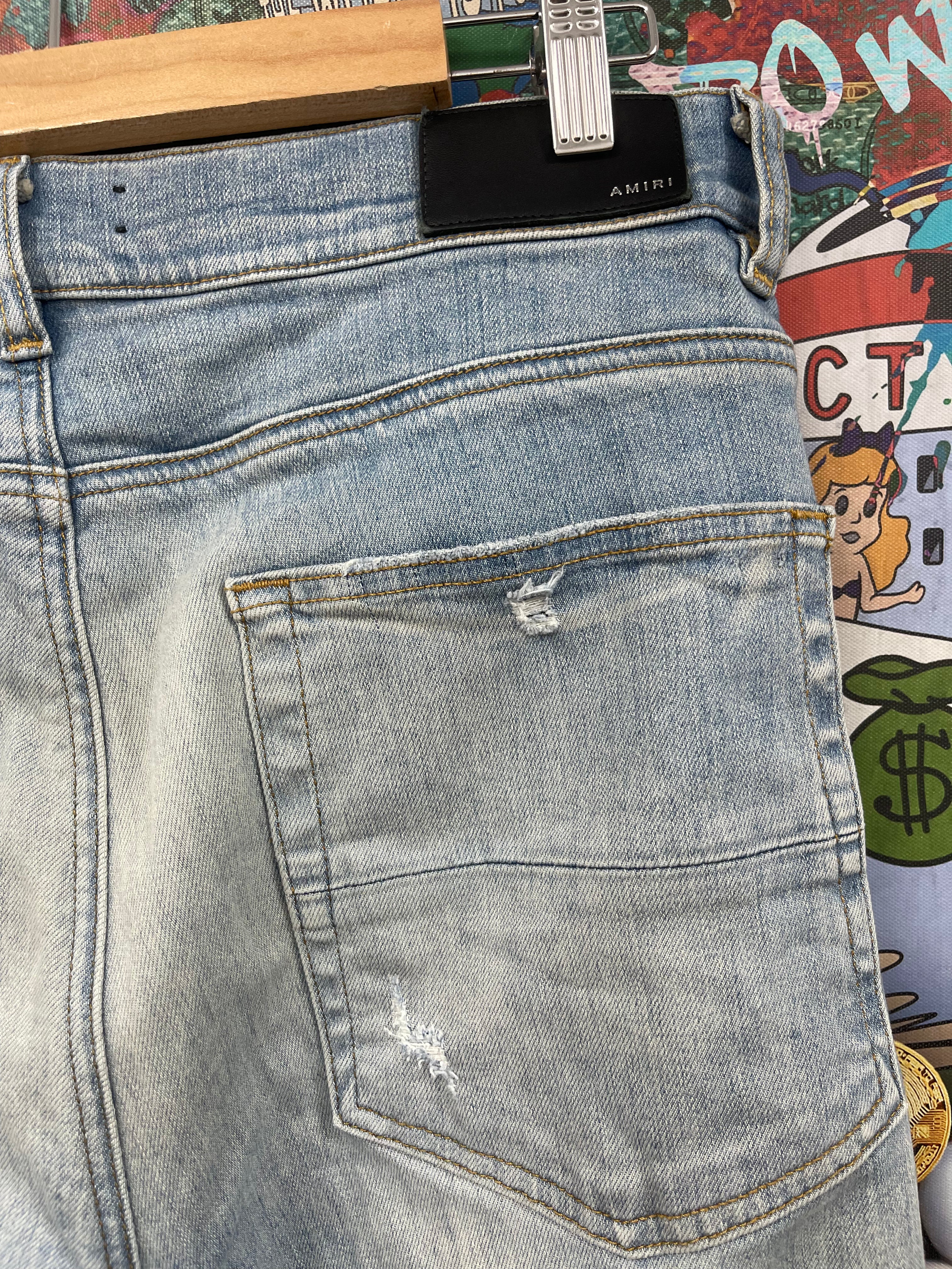 Amiri MX1 Light Wash White Suede Patch Jeans