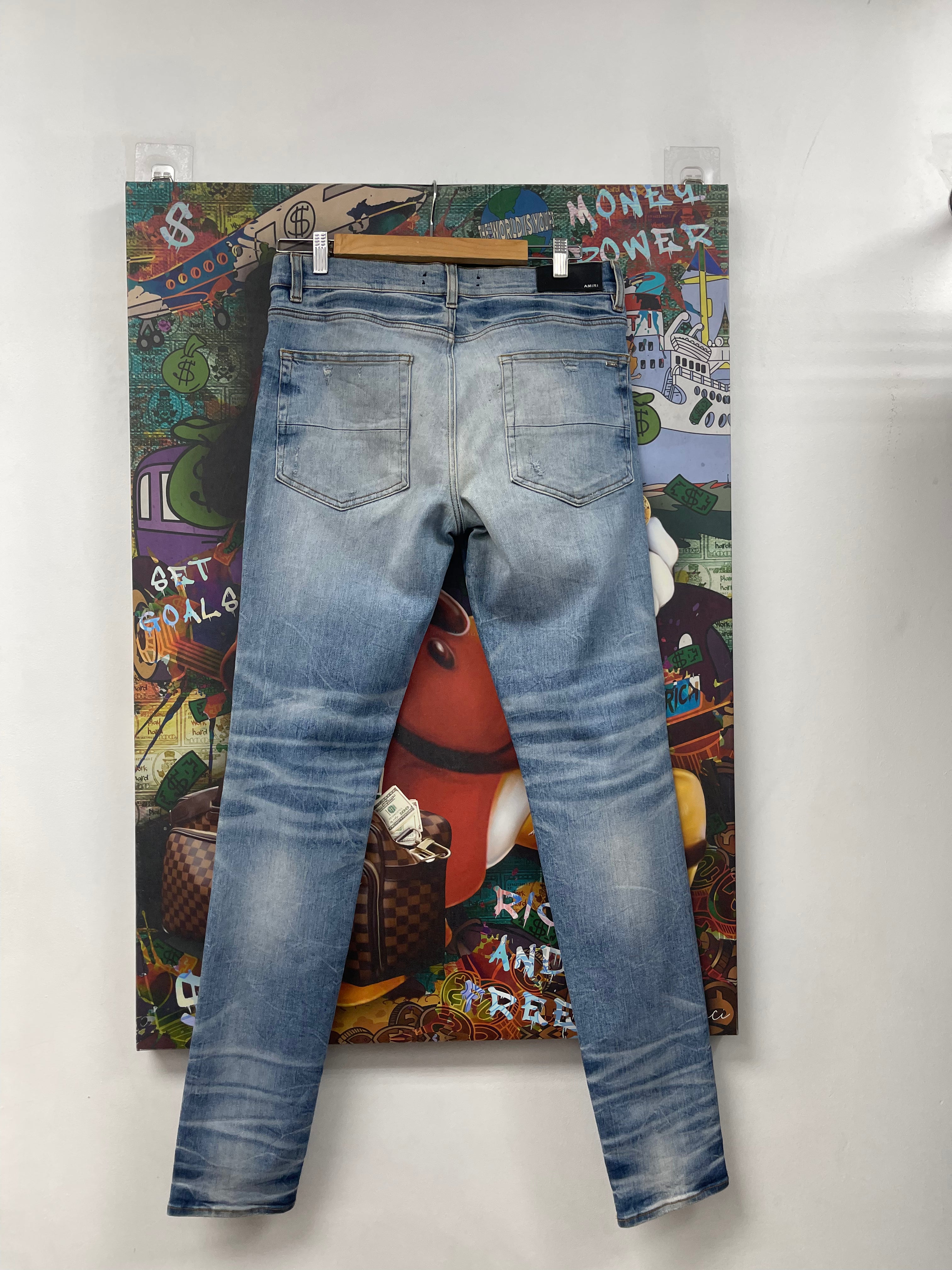 Amiri MX1 Light Wash Black Music Patch Jeans