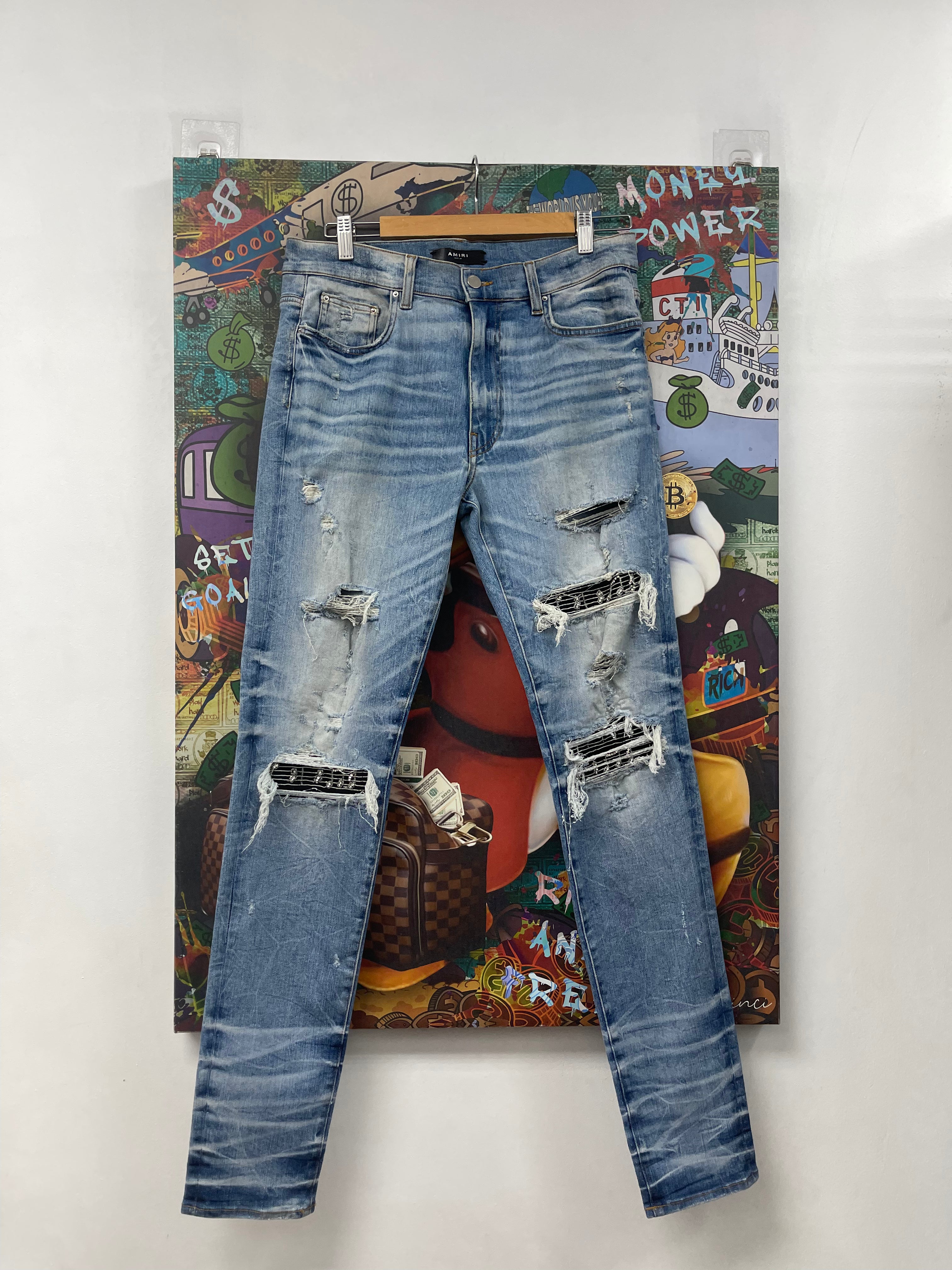 Amiri MX1 Light Wash Black Music Patch Jeans