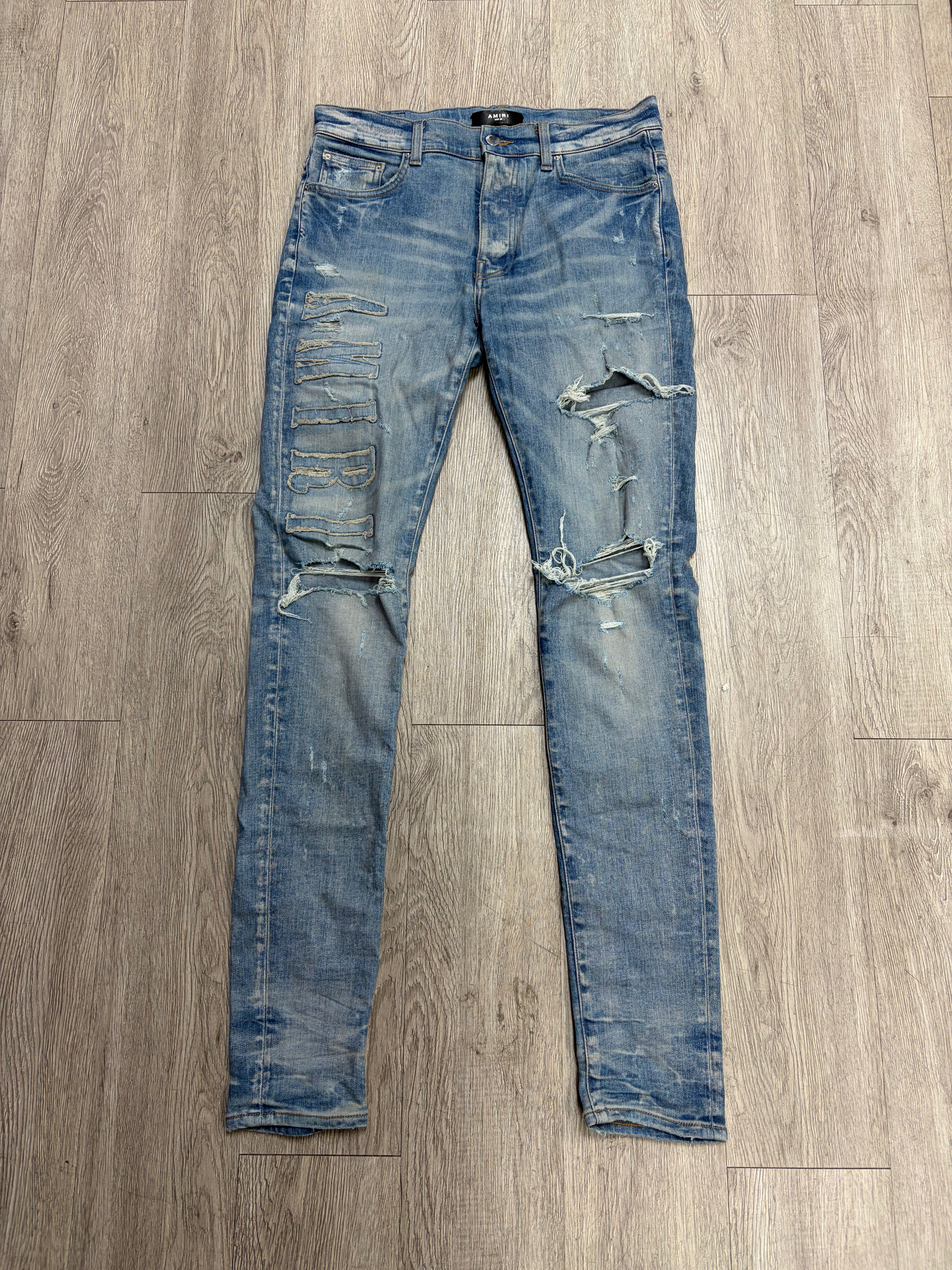 Amiri Light Wash Denim Applique Side Logo Jeans