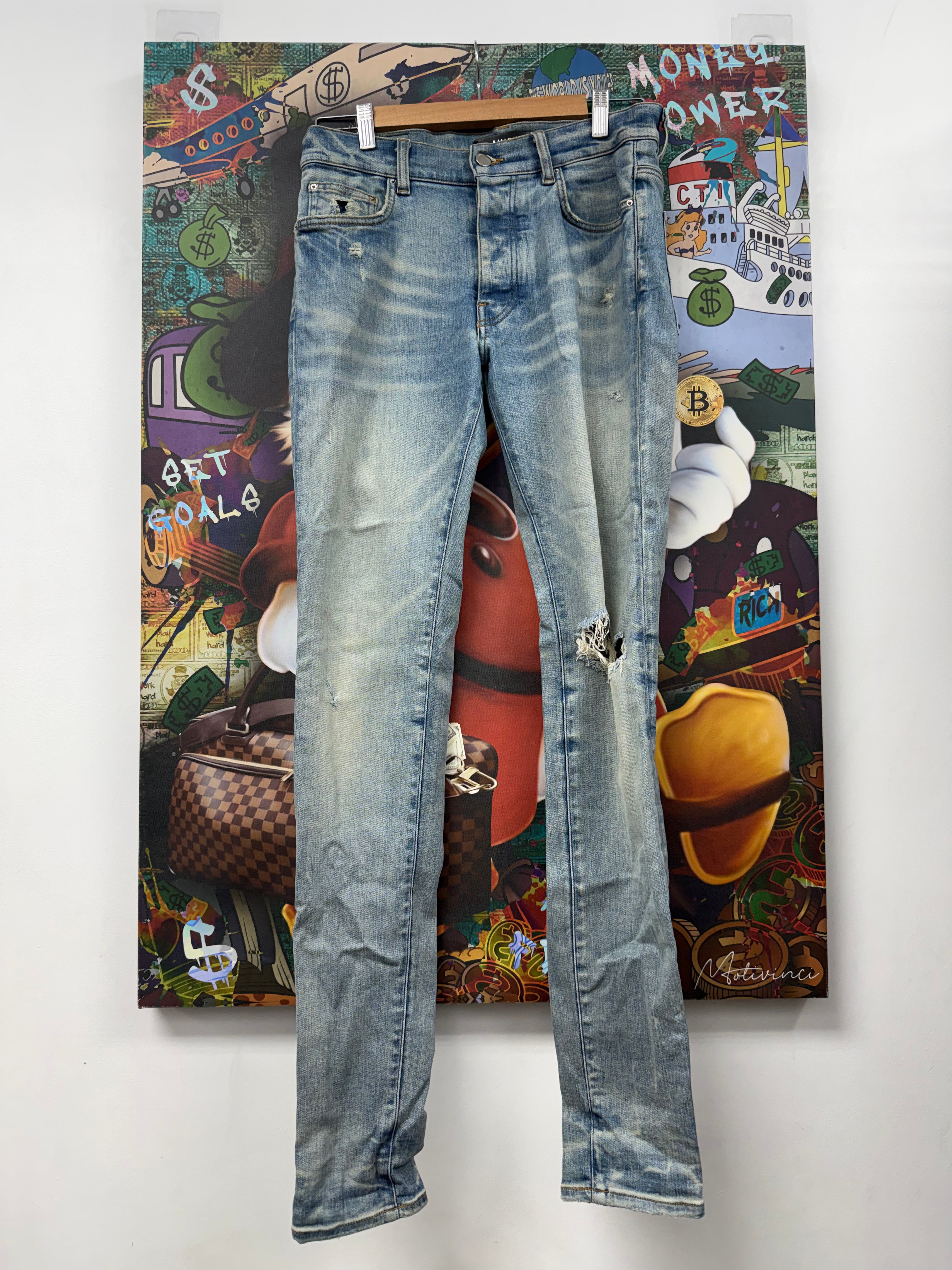 Amiri Light Wash Knee Rip Jeans