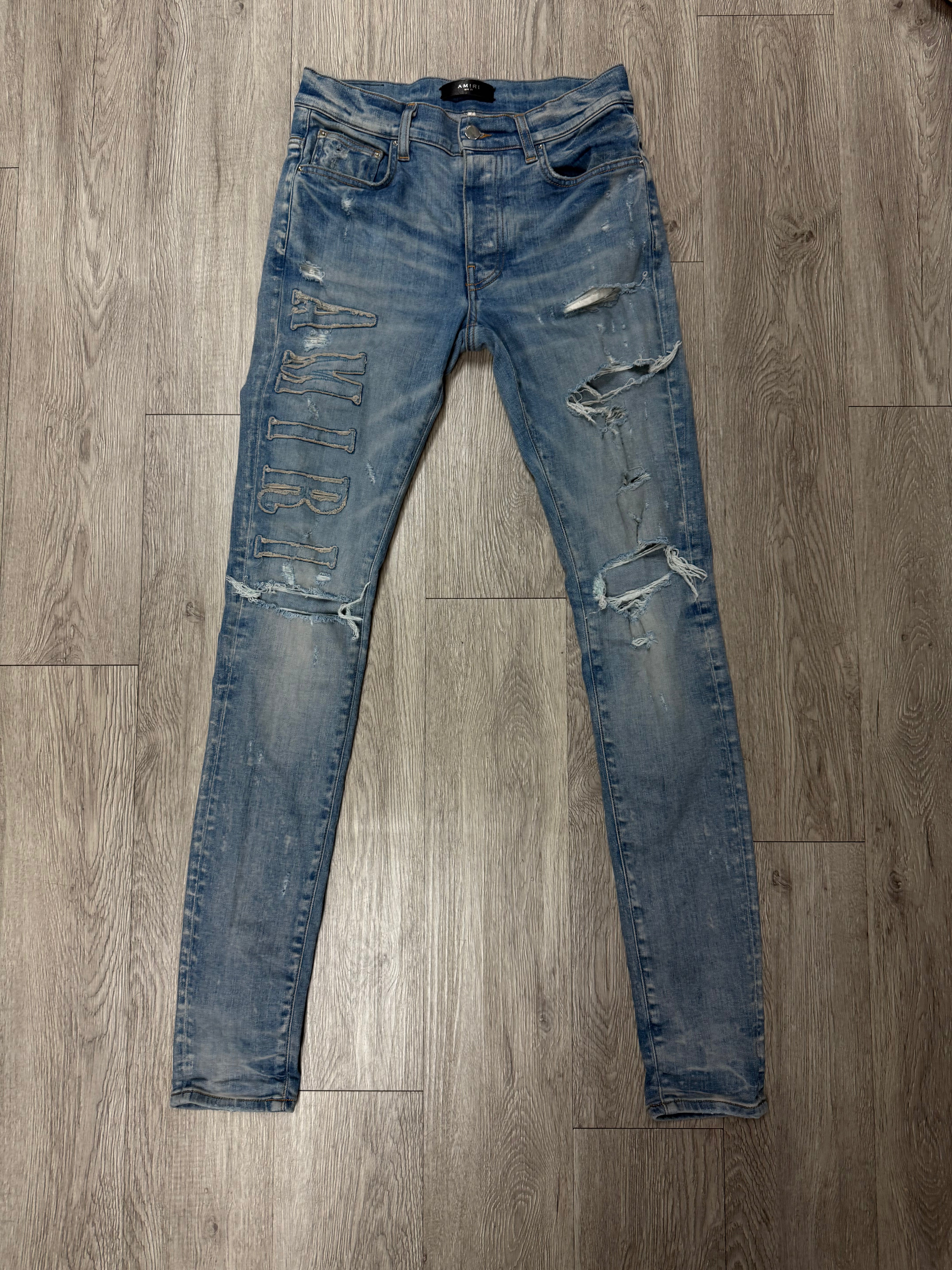 Amiri Light Wash Denim Applique Side Logo Jeans