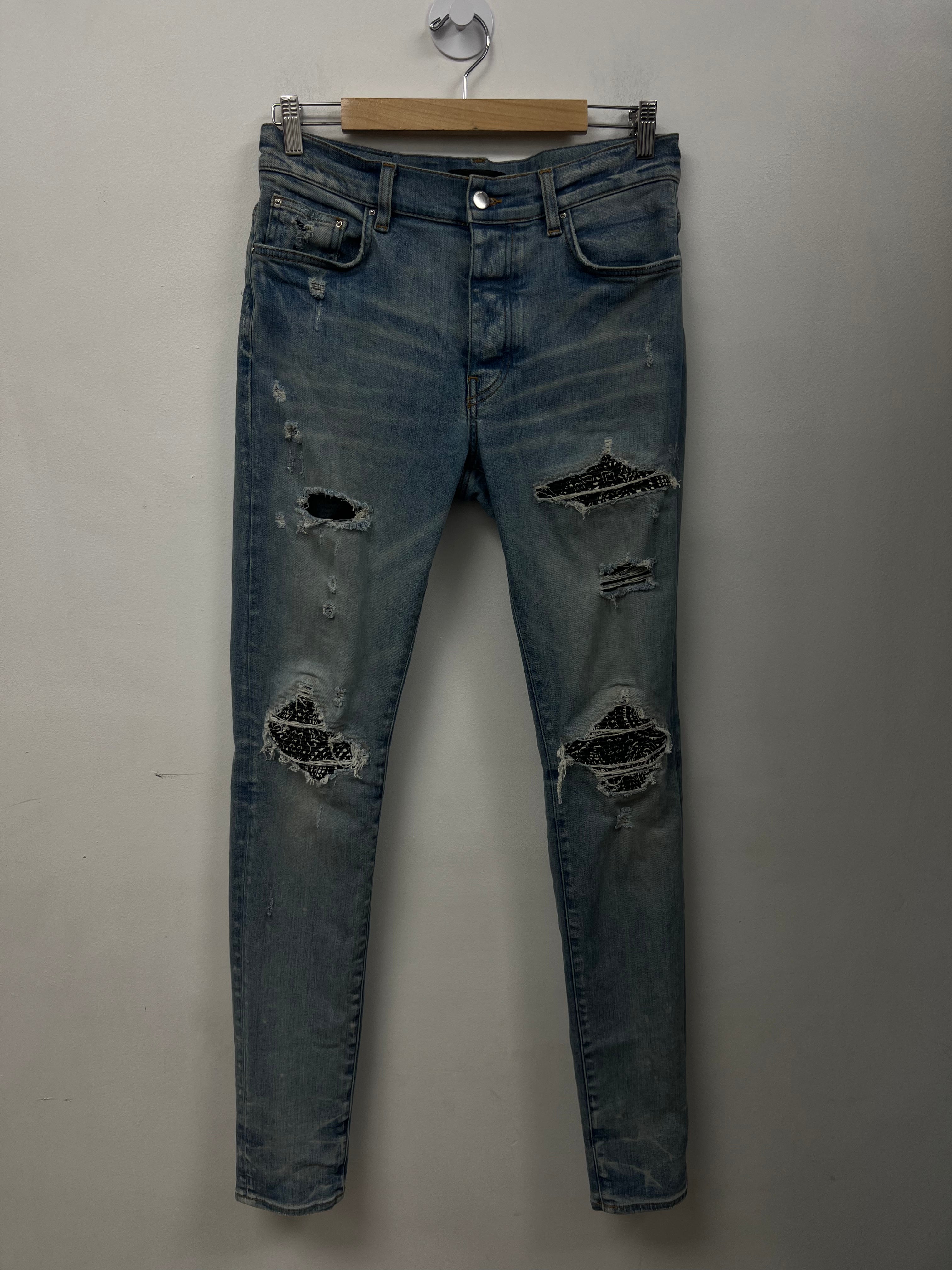 Amiri MX1 Light Wash Black Bandana Patch Jeans