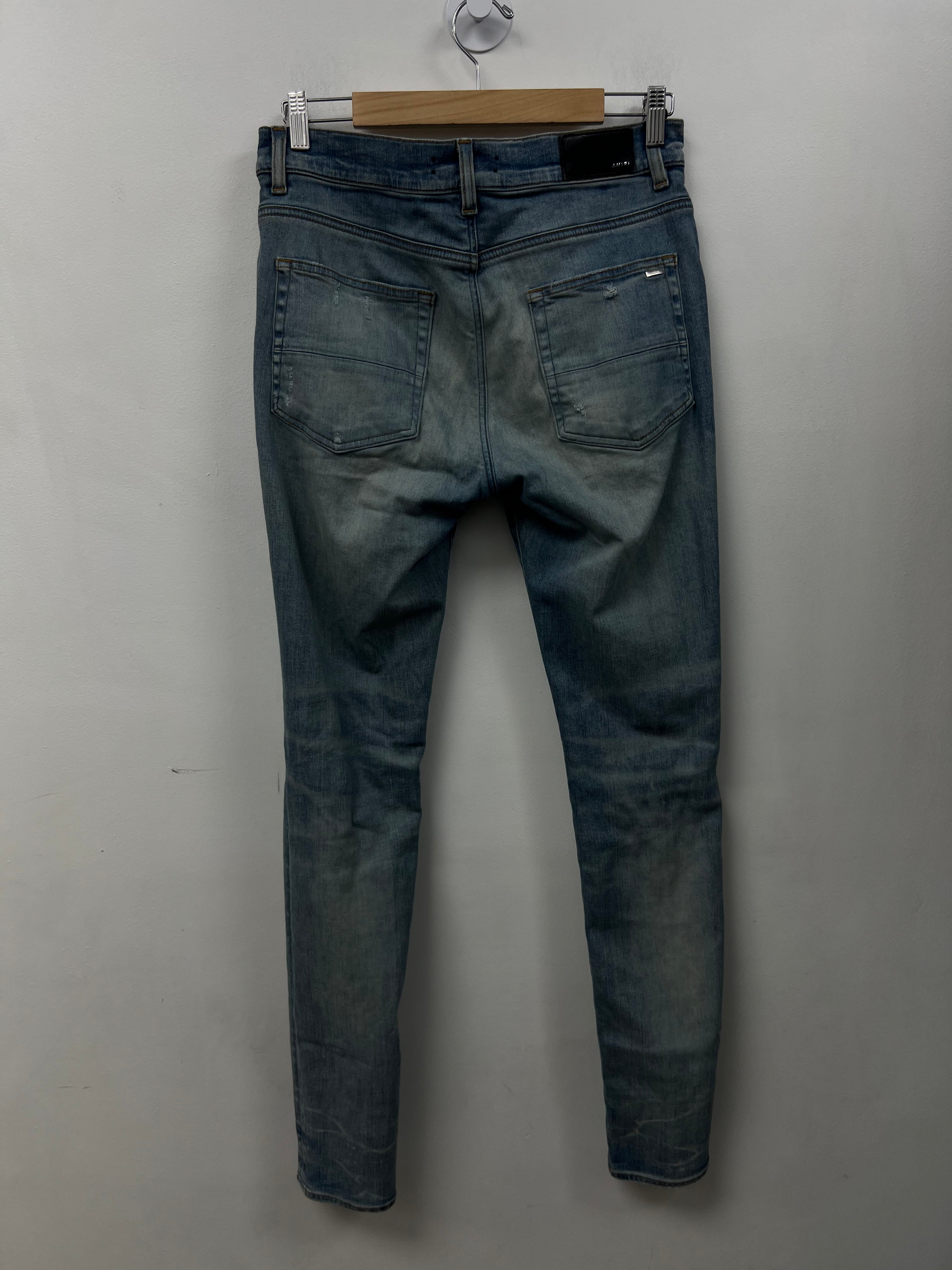 Amiri MX1 Light Wash Black Bandana Patch Jeans