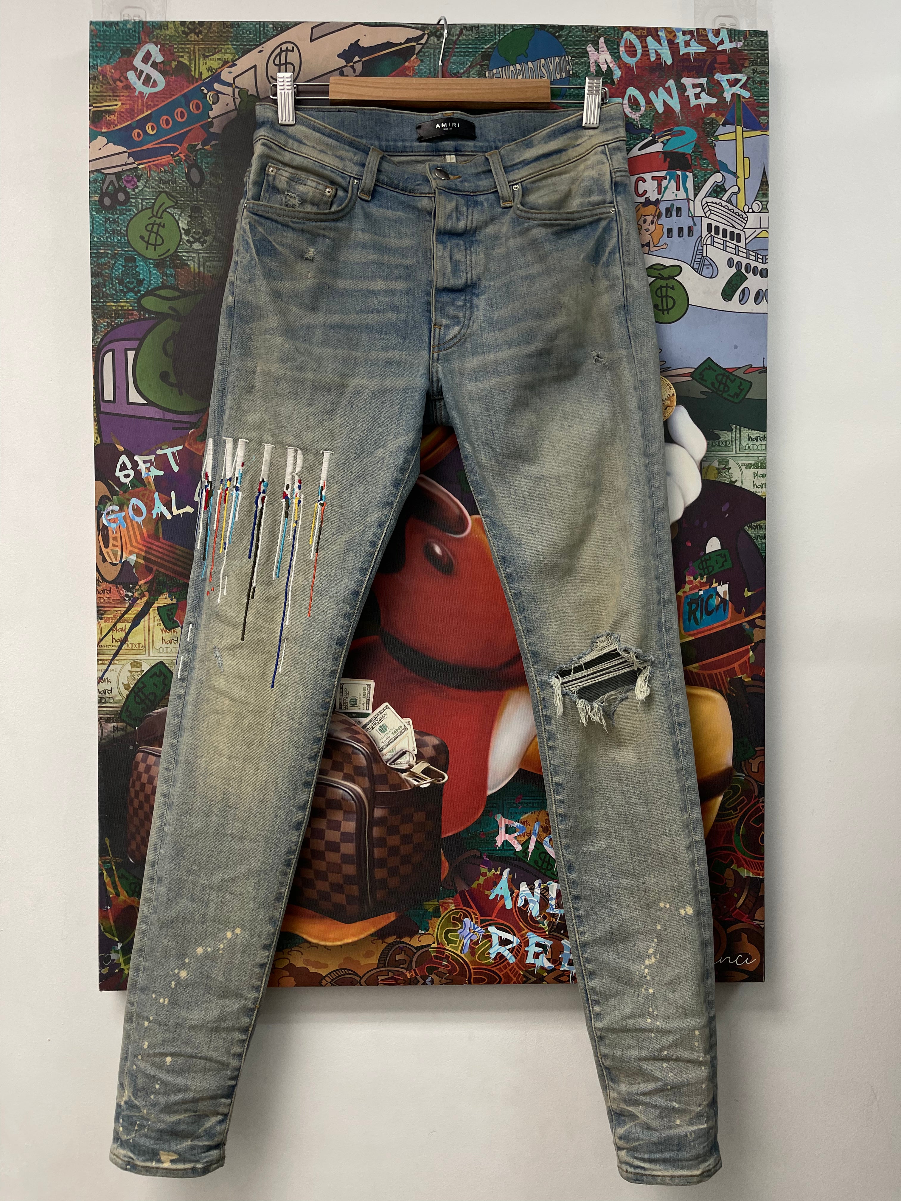 Amiri Light Wash Paint Drip Jeans