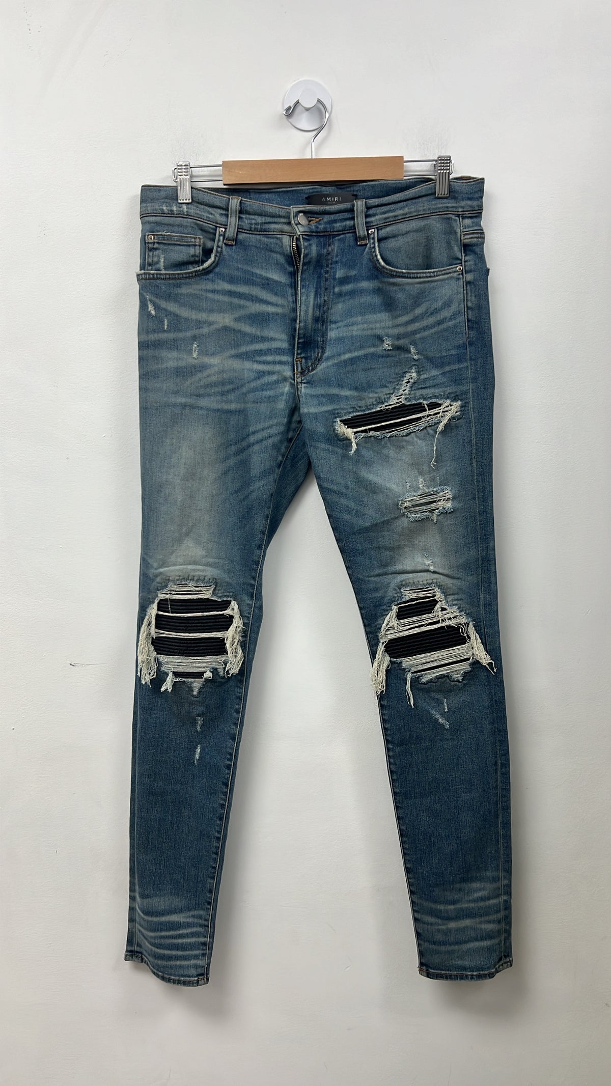 Amiri MX1 Light Wash Black Patch Zipper Jeans
