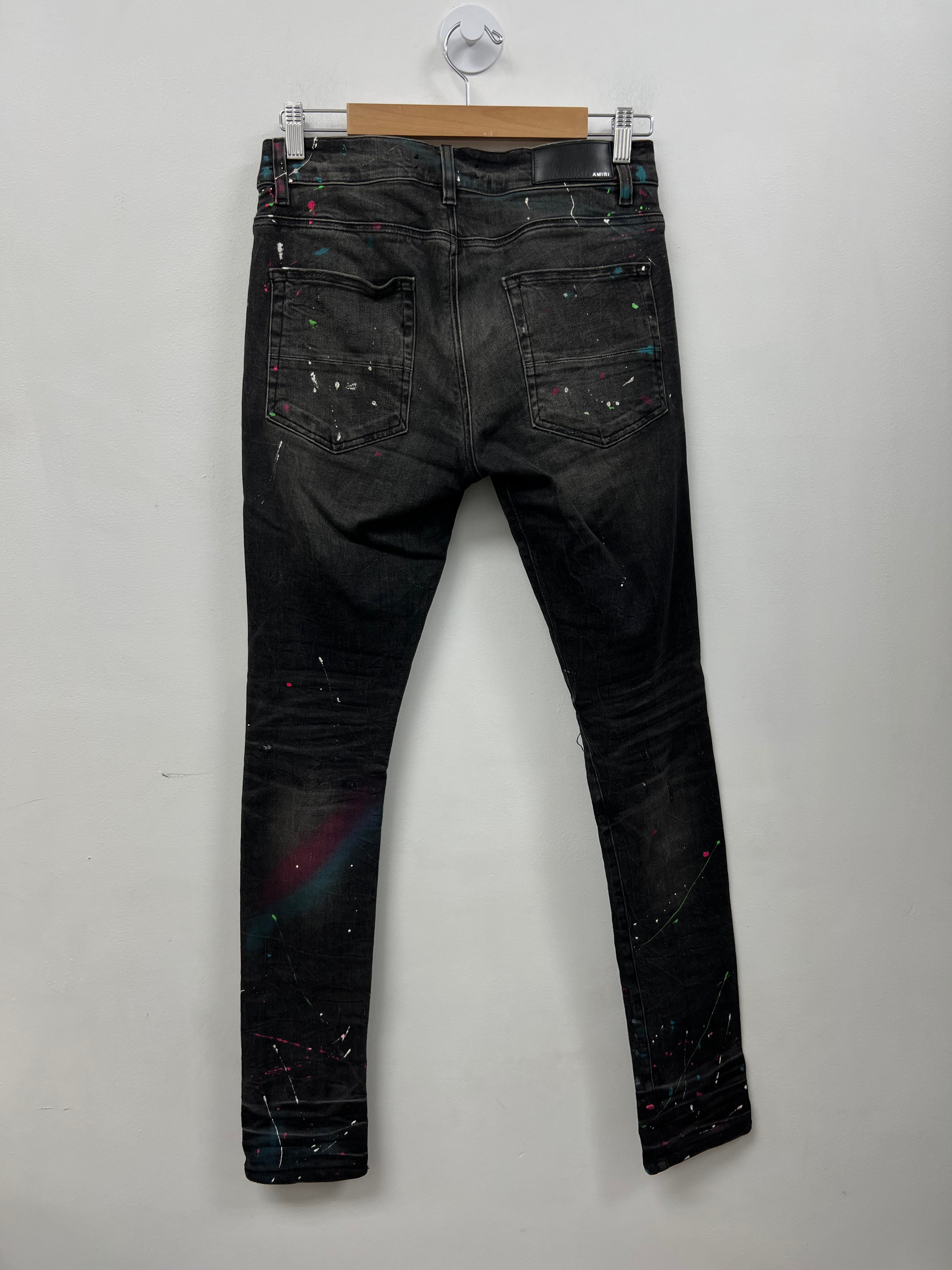 Amiri Black Wash South Bleach Splatter Ripped Thrasher Jeans