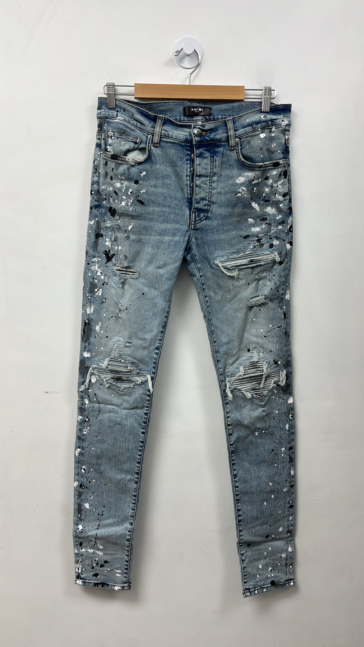 Amiri MX1 Light Wash Denim Splatter Patch Jeans