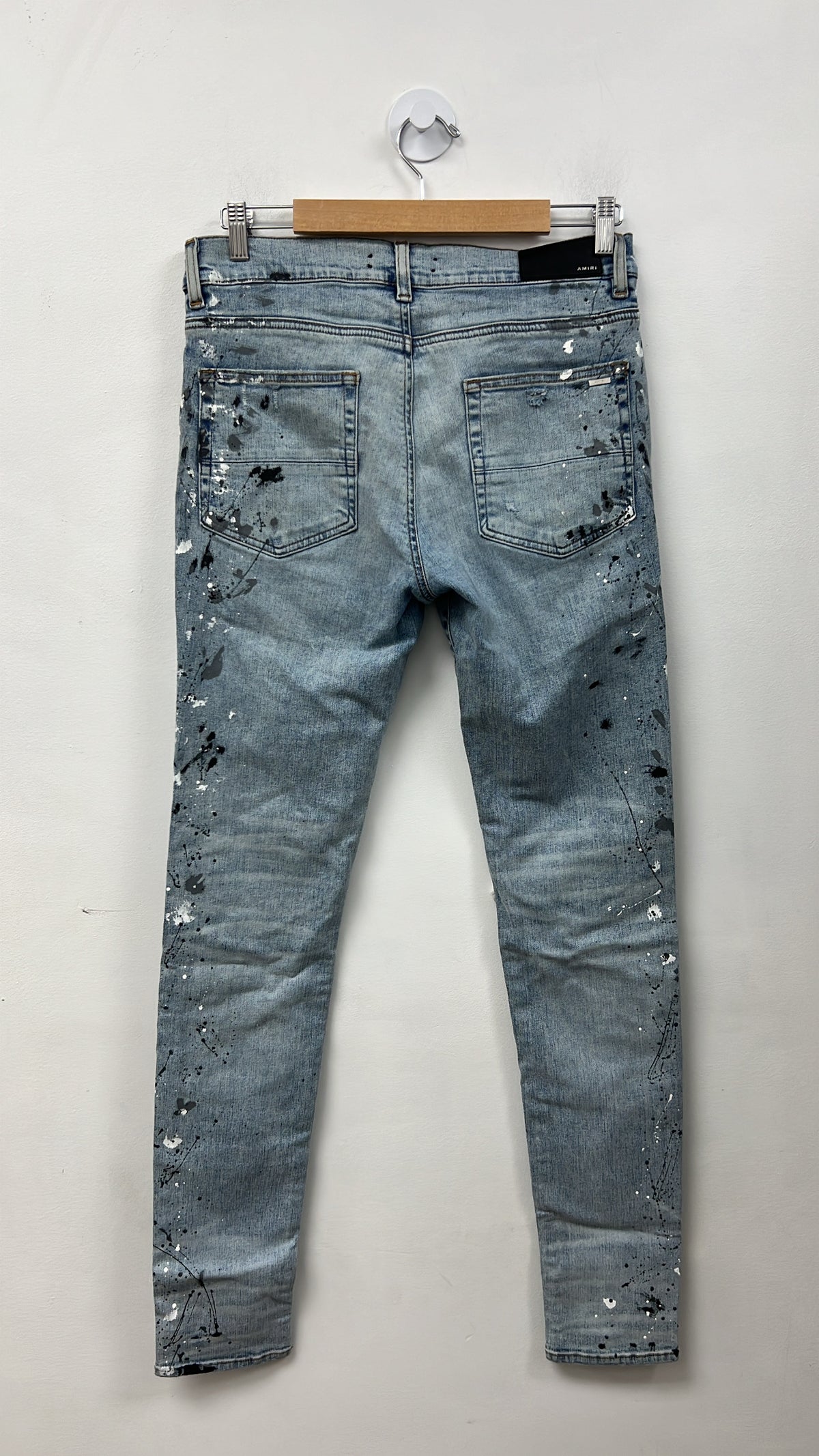 Amiri MX1 Light Wash Denim Splatter Patch Jeans