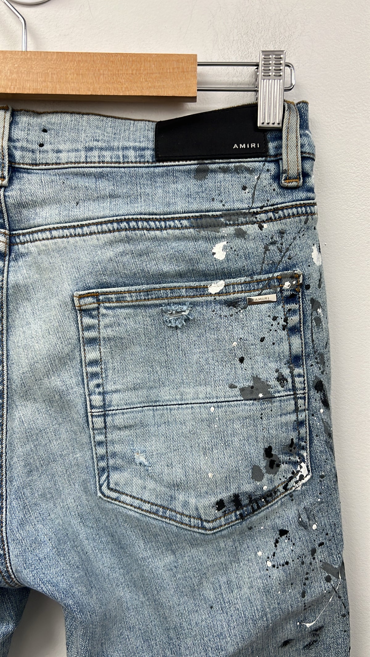 Amiri MX1 Light Wash Denim Splatter Patch Jeans