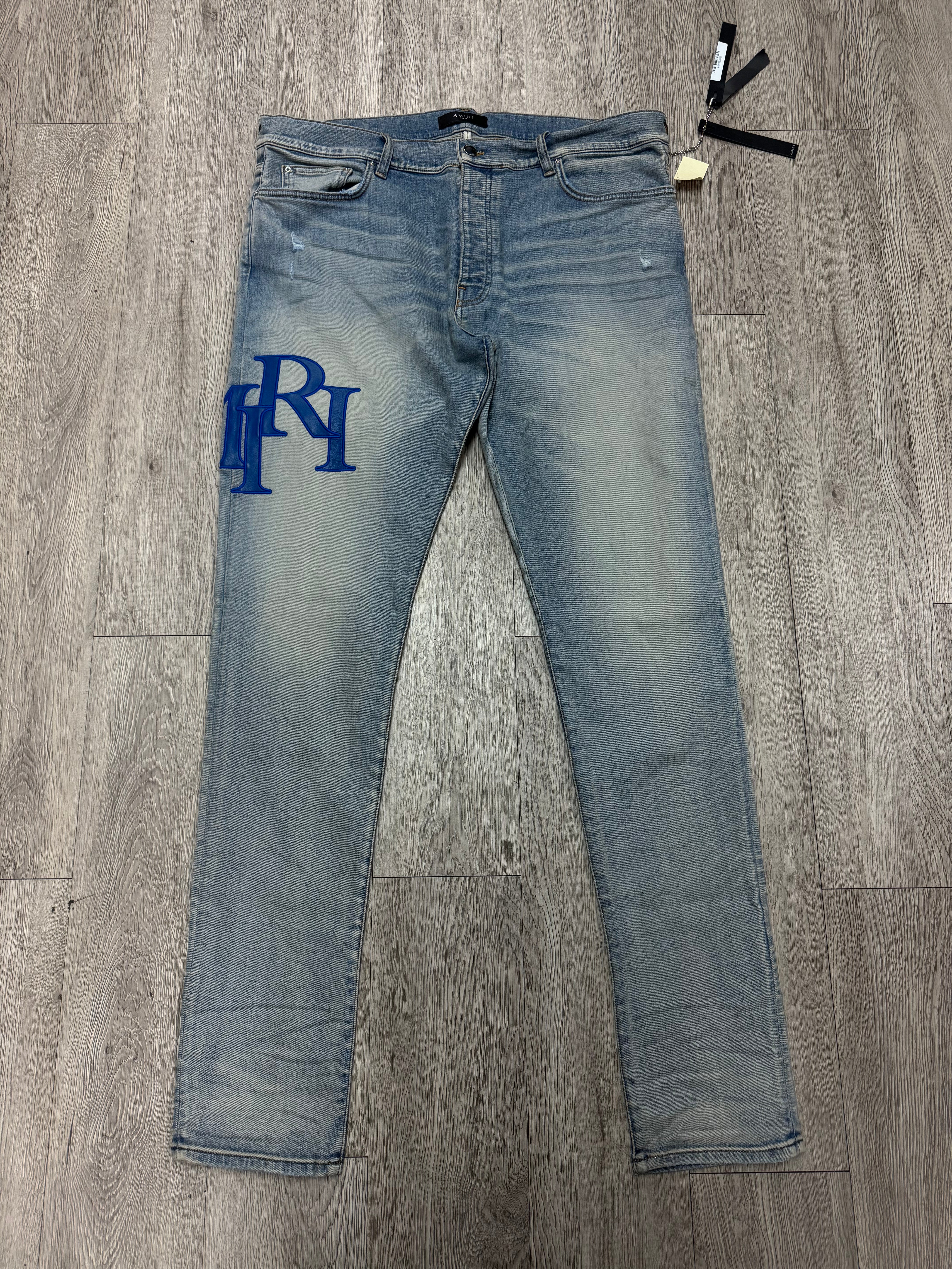 Amiri Light Wash Blue Staggered Side Logo Jeans