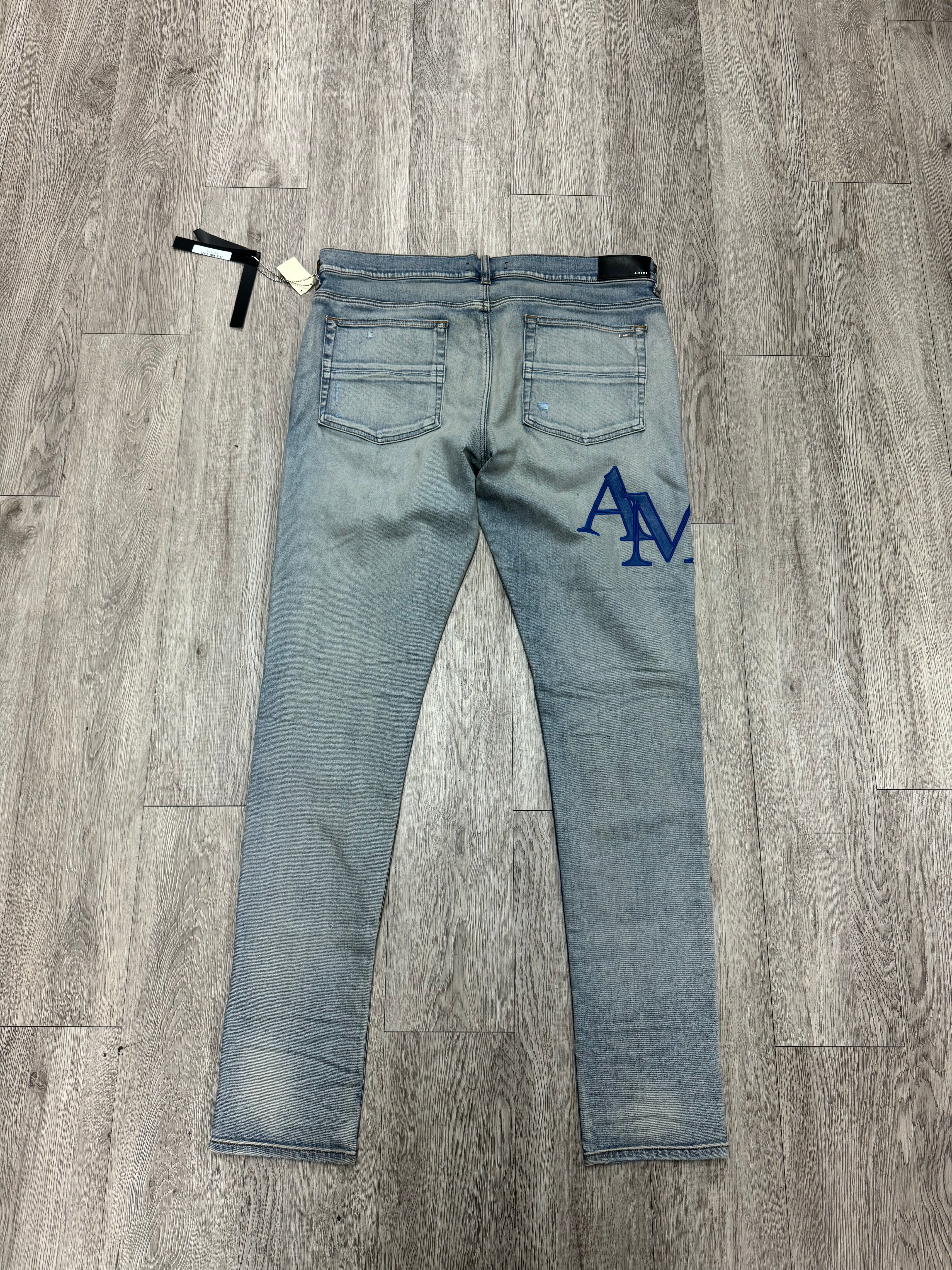 Amiri Light Wash Blue Staggered Side Logo Jeans