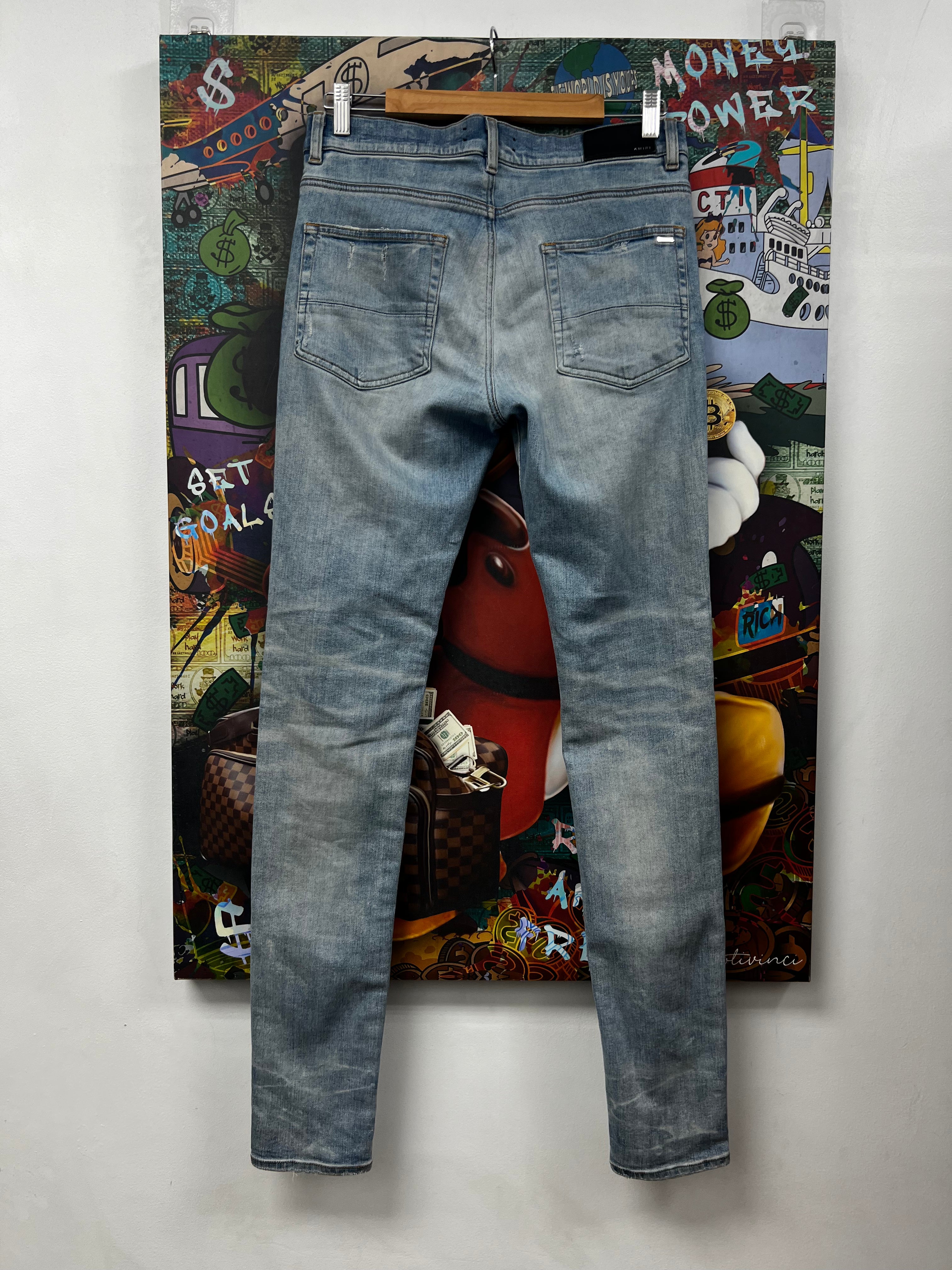 Amiri MX1 Light Wash White Suede Patch Jeans