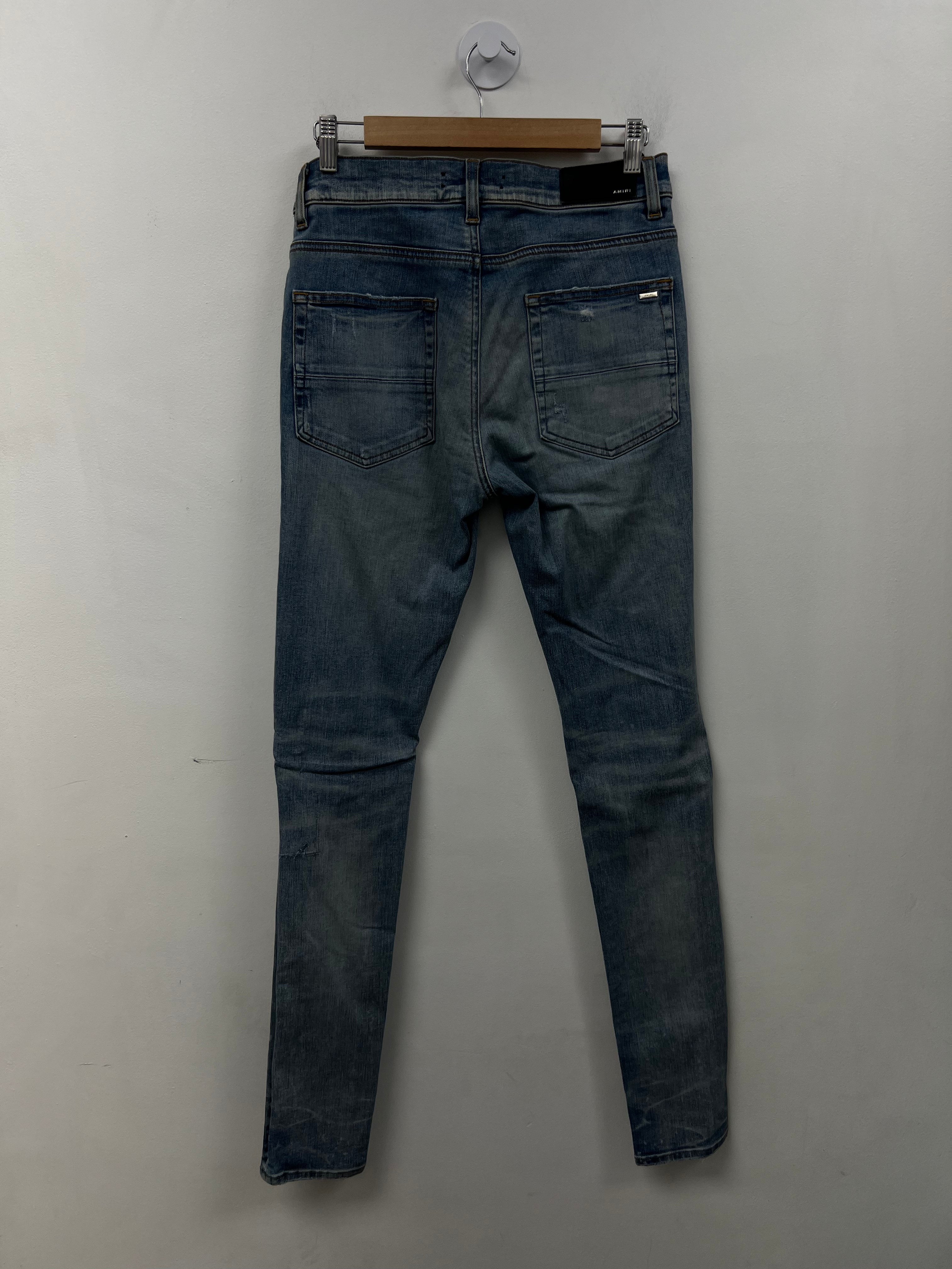 Amiri MX1 Light Wash Pink Crackle Patch Jeans