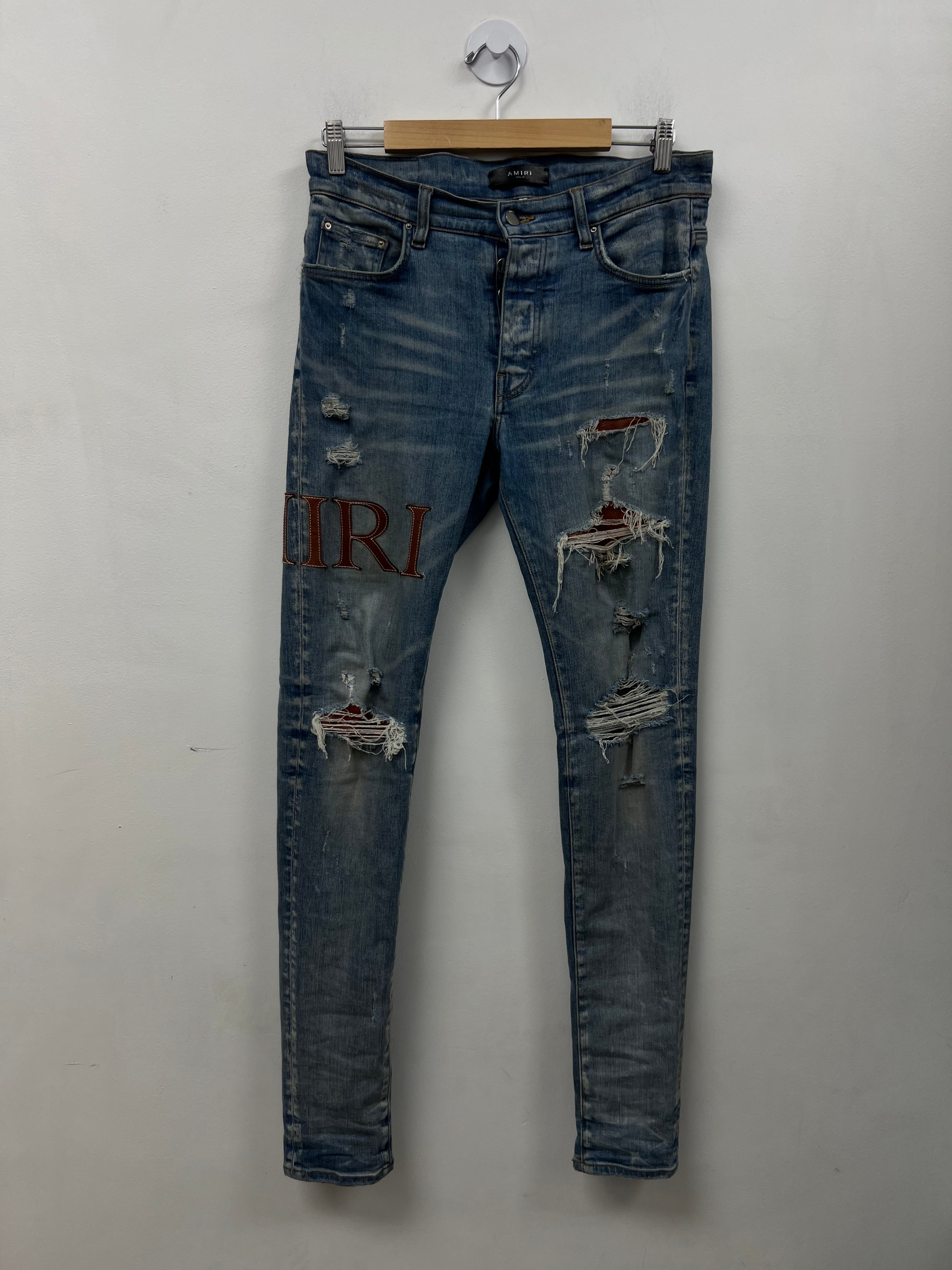 Amiri Light Wash Clay Side Logo Jeans