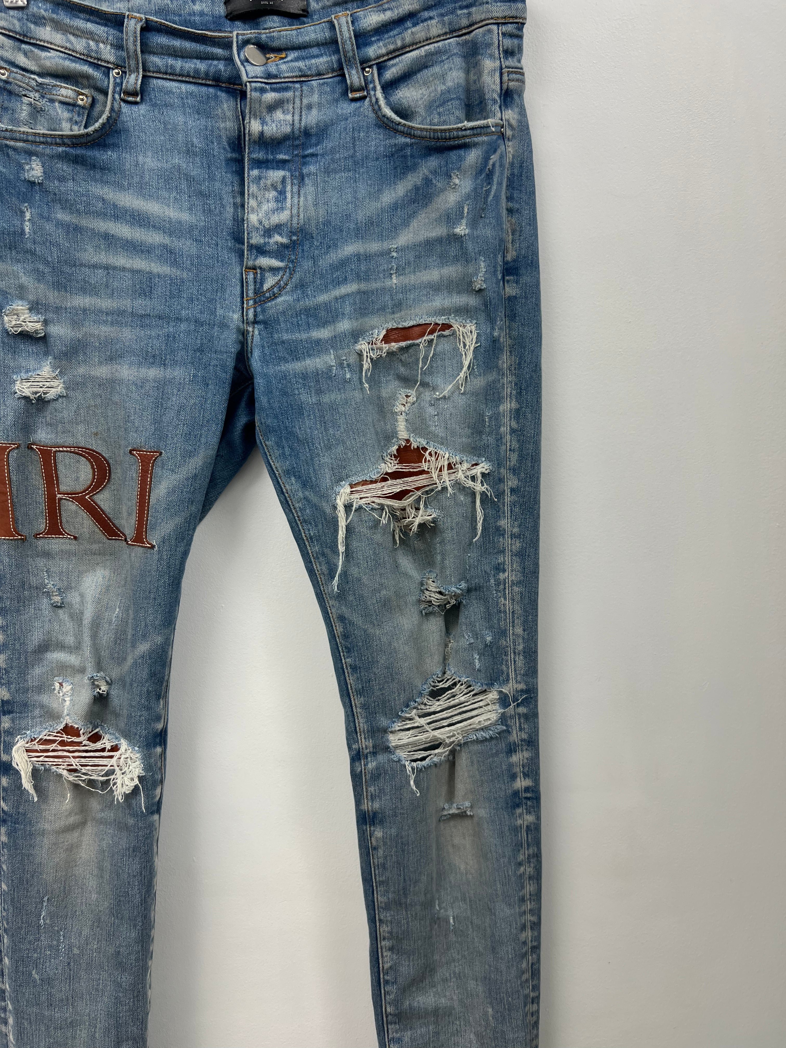 Amiri Light Wash Clay Side Logo Jeans