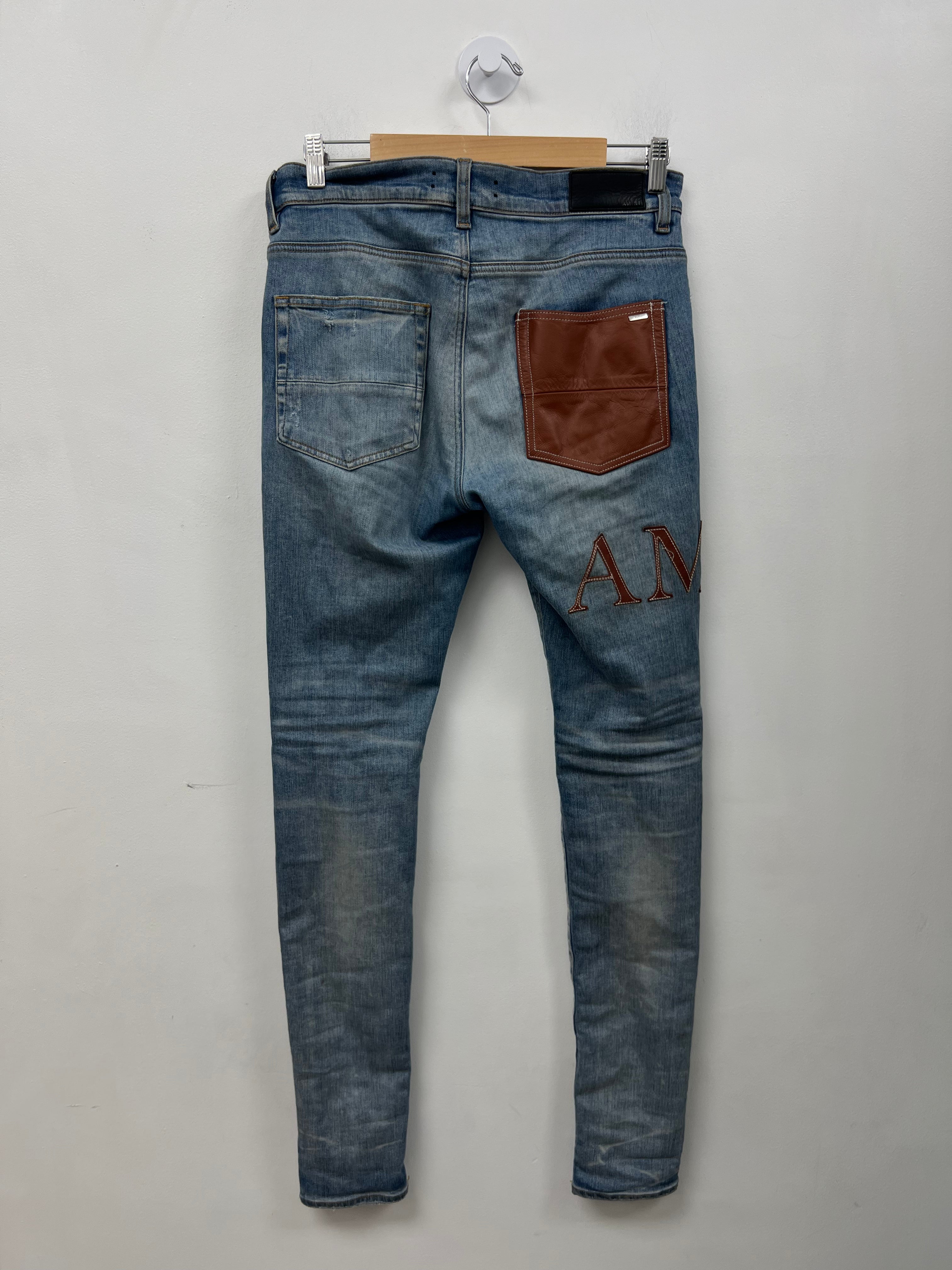 Amiri Light Wash Clay Side Logo Jeans