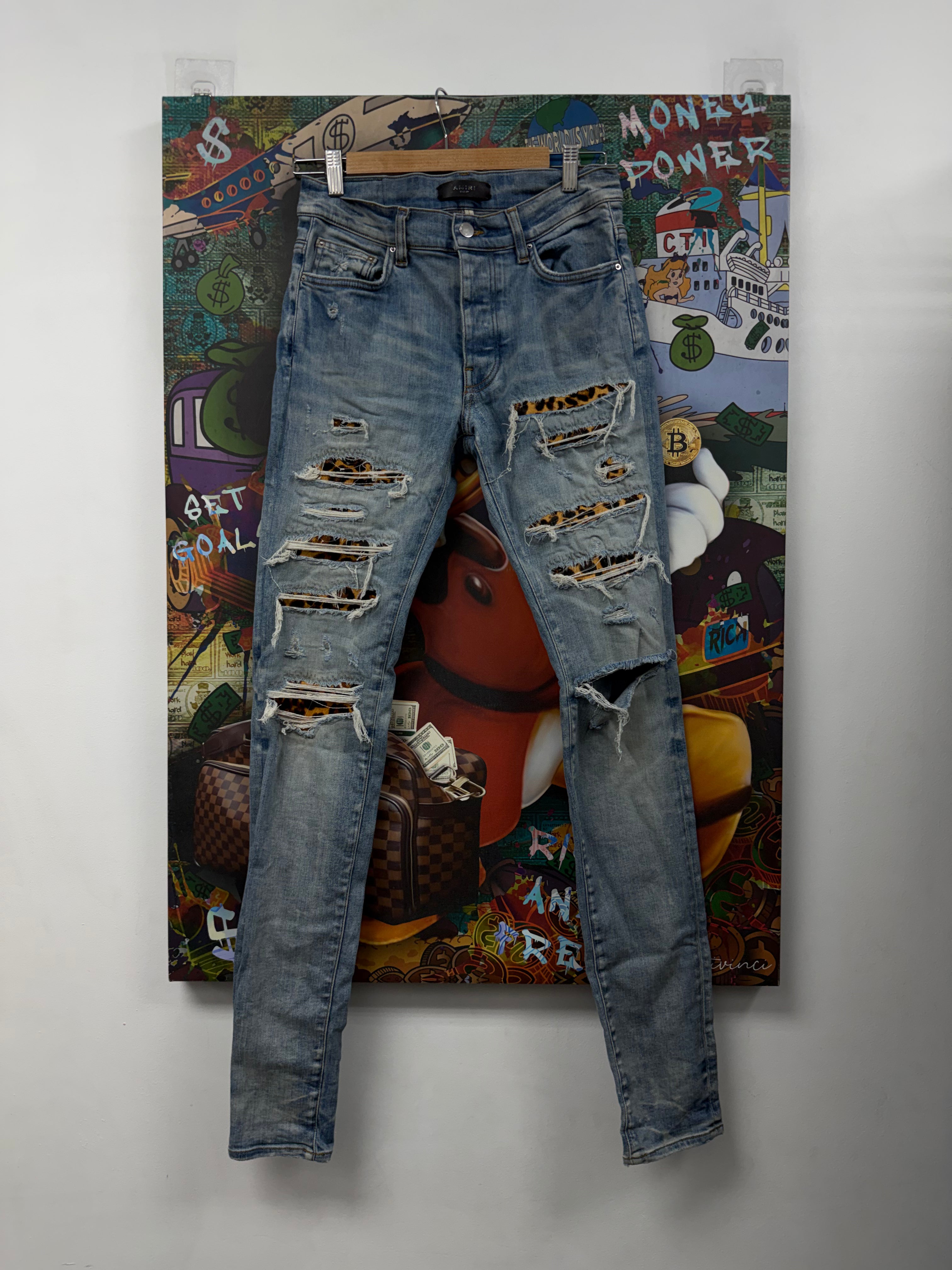 Amiri Light Wash Cheetah Patch Thrasher Jeans