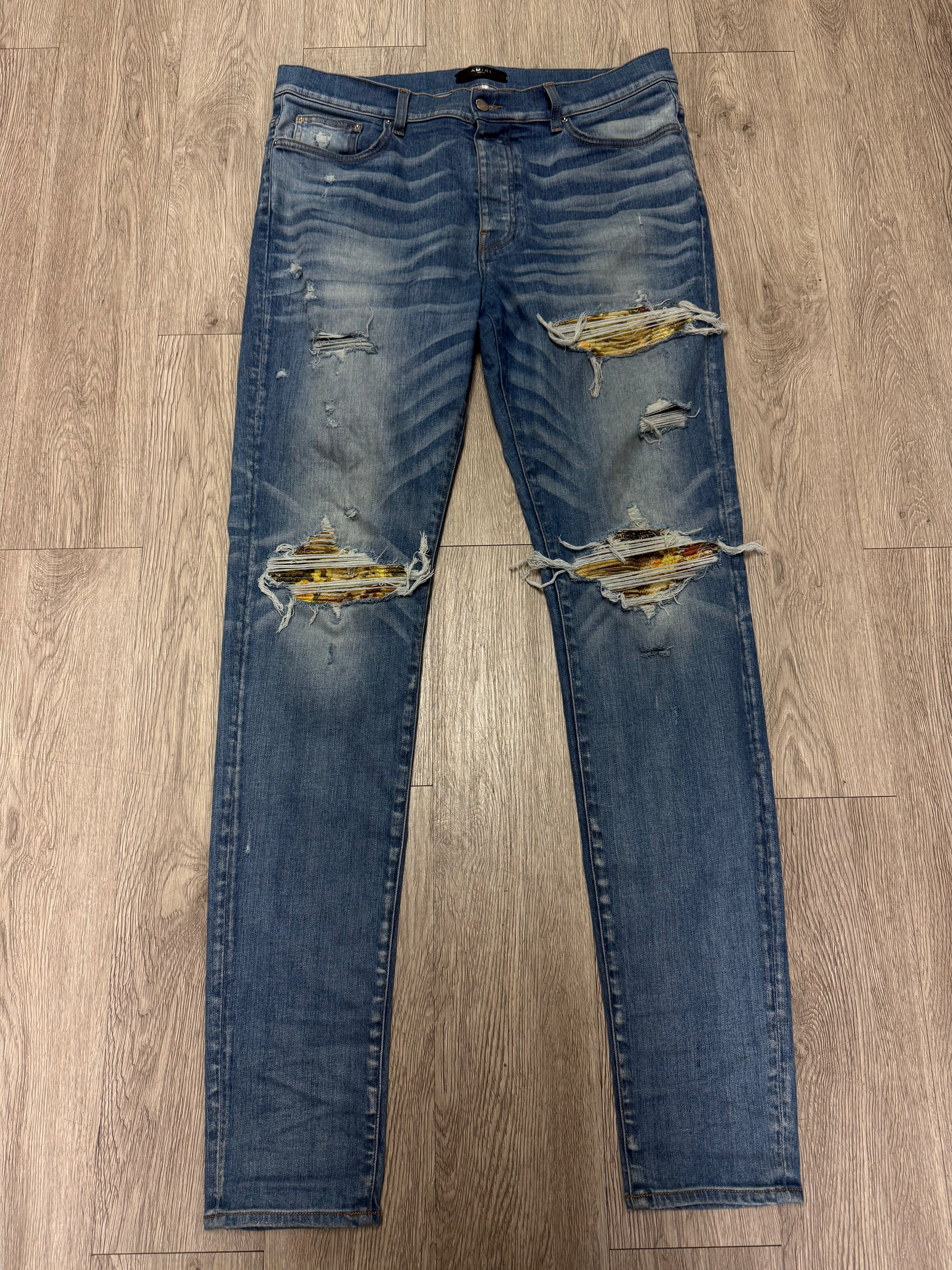 Amiri MX1 Light Wash Aloha Patch Jeans