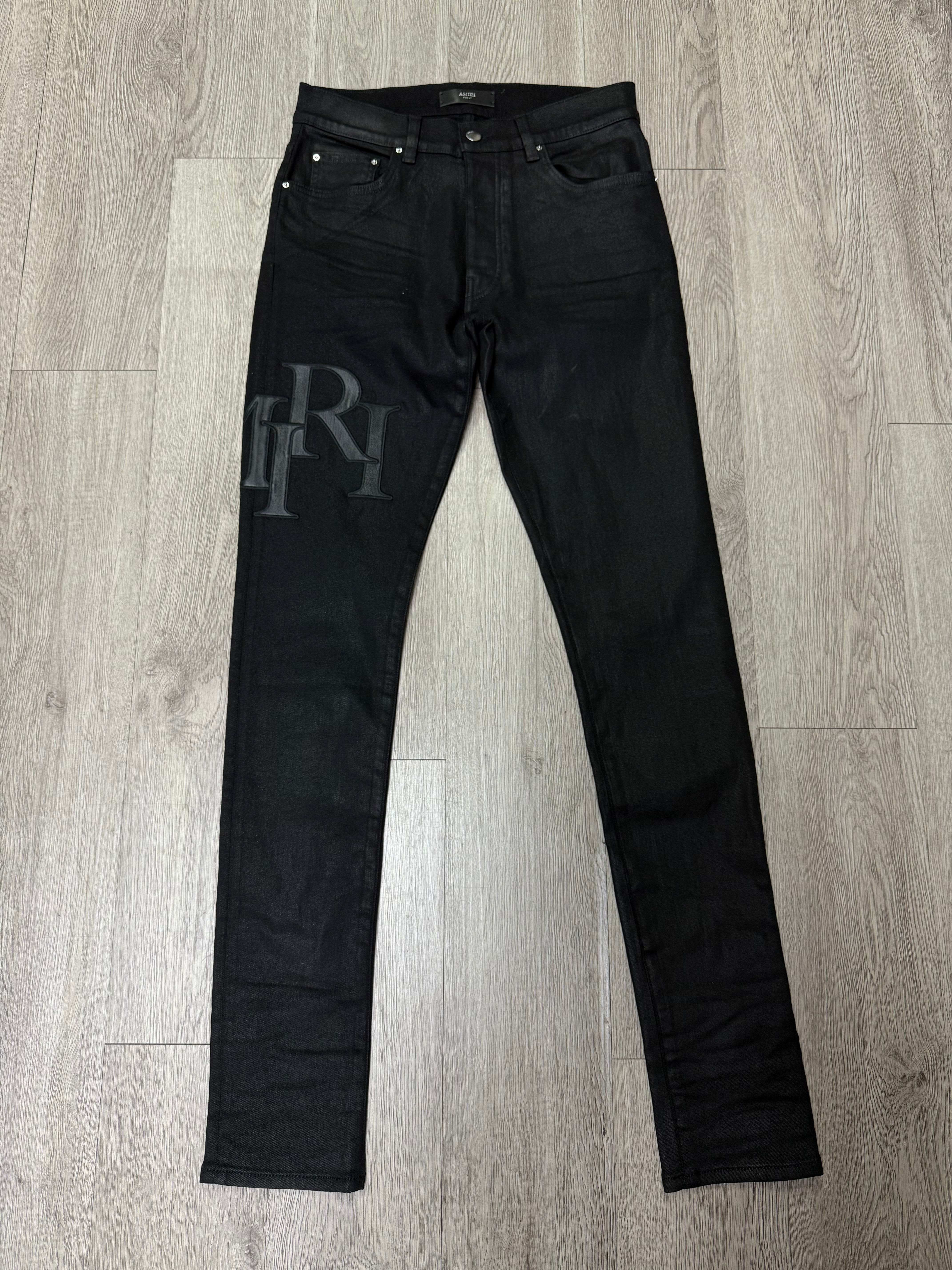 Amiri Black Wax Staggered Side Logo Jeans