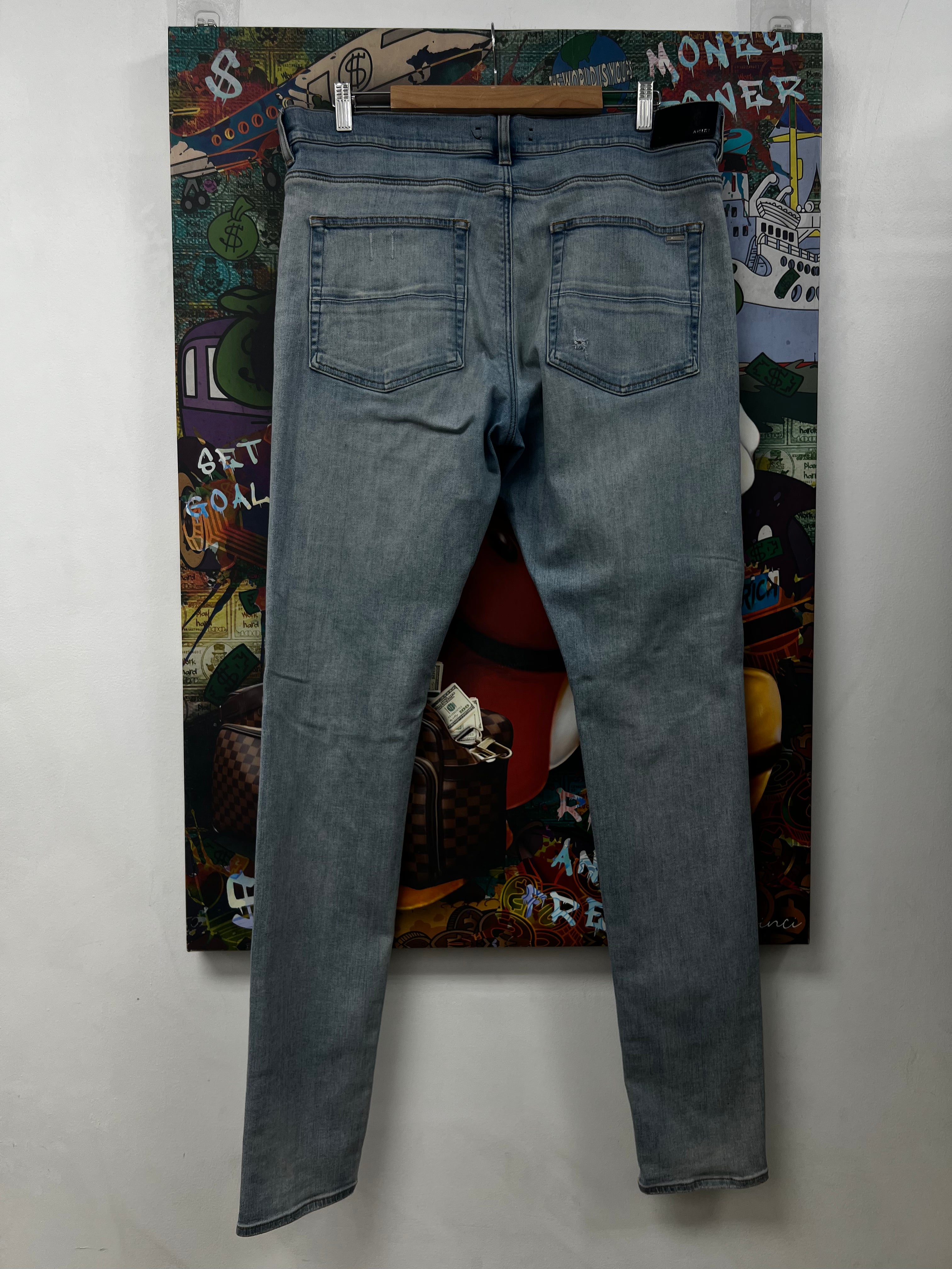 Amiri MX1 Light Wash White Patch Jeans