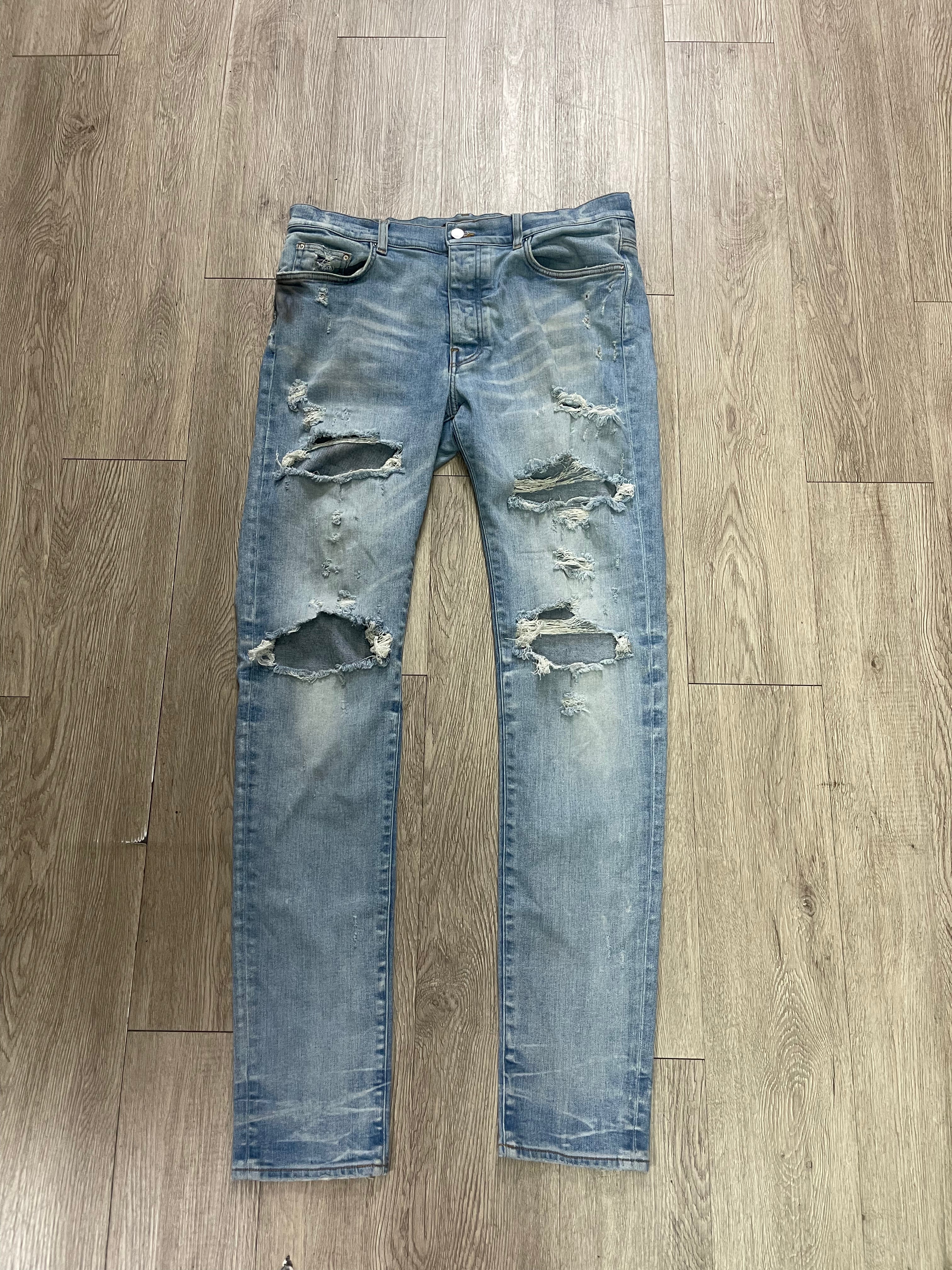 Amiri Light Wash Ripped Thrasher Jeans