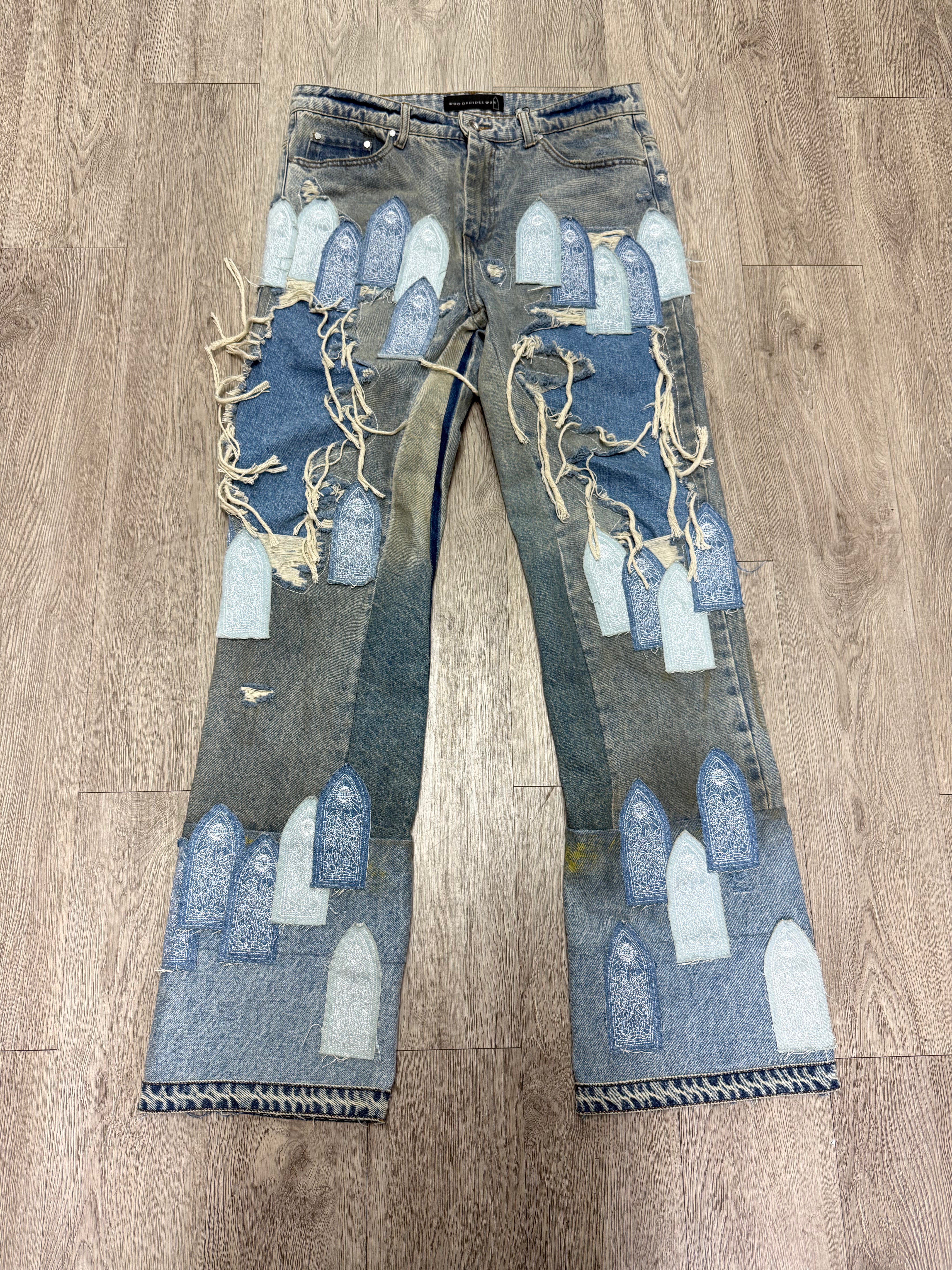 Who Decides War Light Wash Patched Arched Denim Jeans