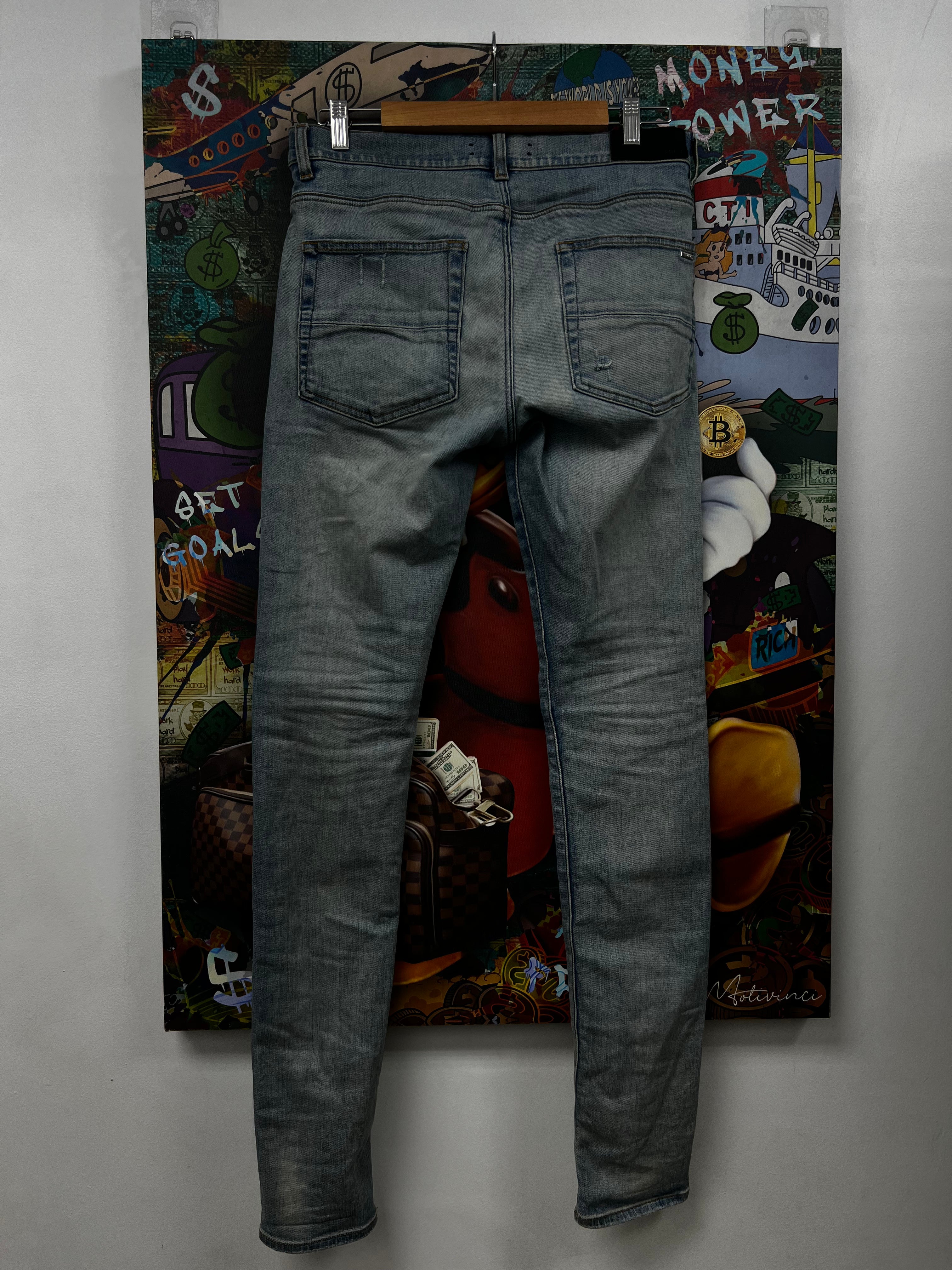 Amiri MX1 Light Wash White Patch Jeans