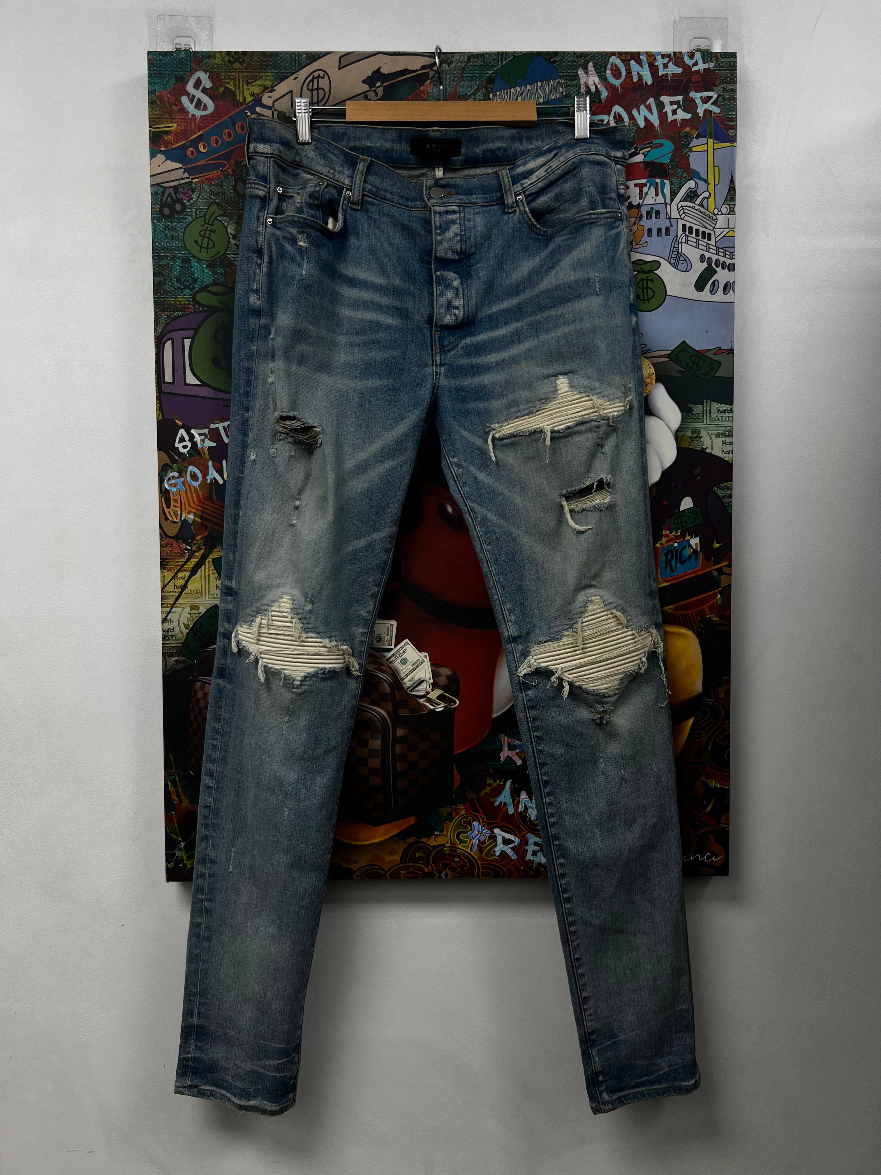 Amiri MX1 Light Wash White Patch Jeans