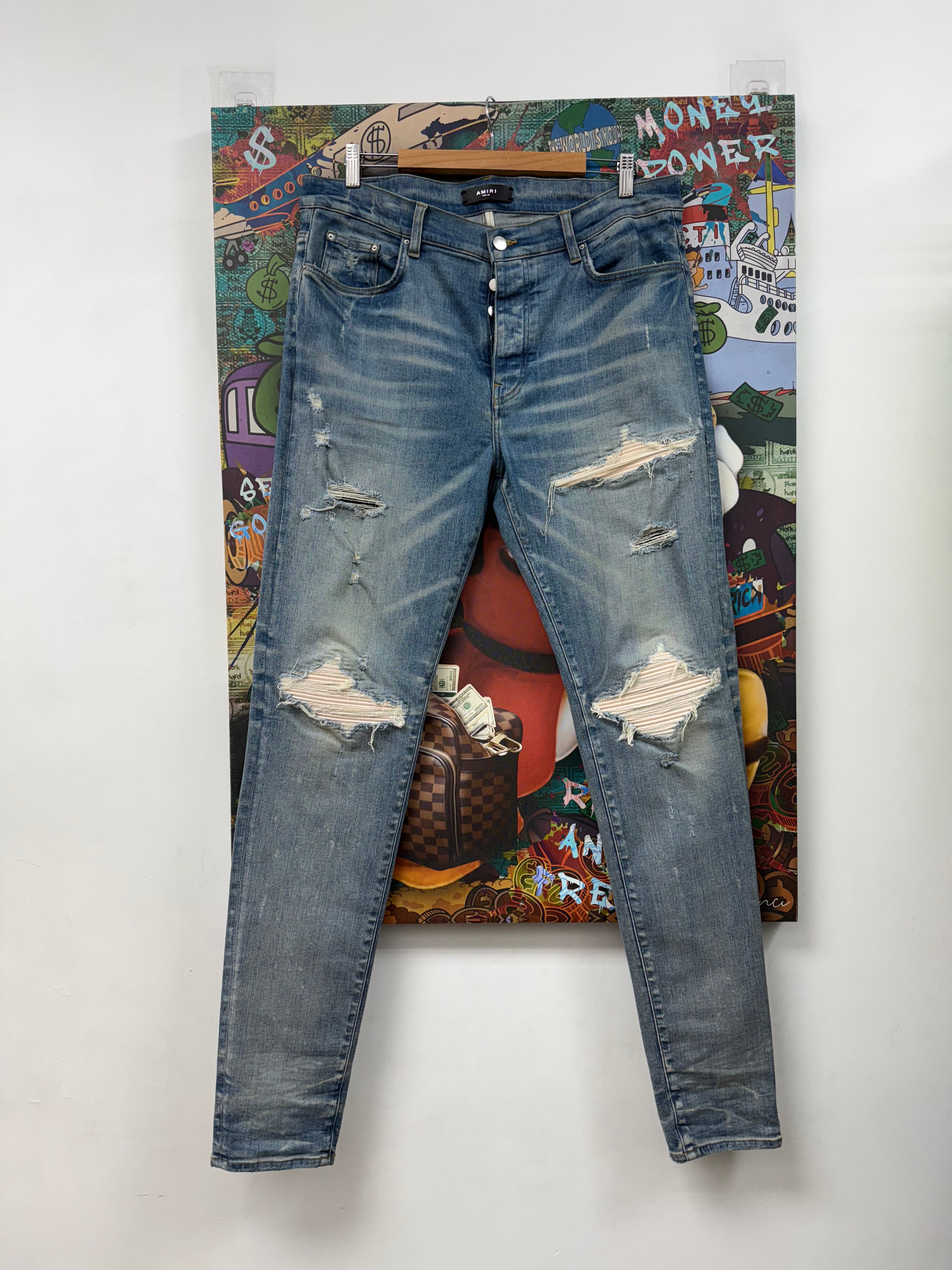 Amiri Mx1 Light Wash White Patch Jeans