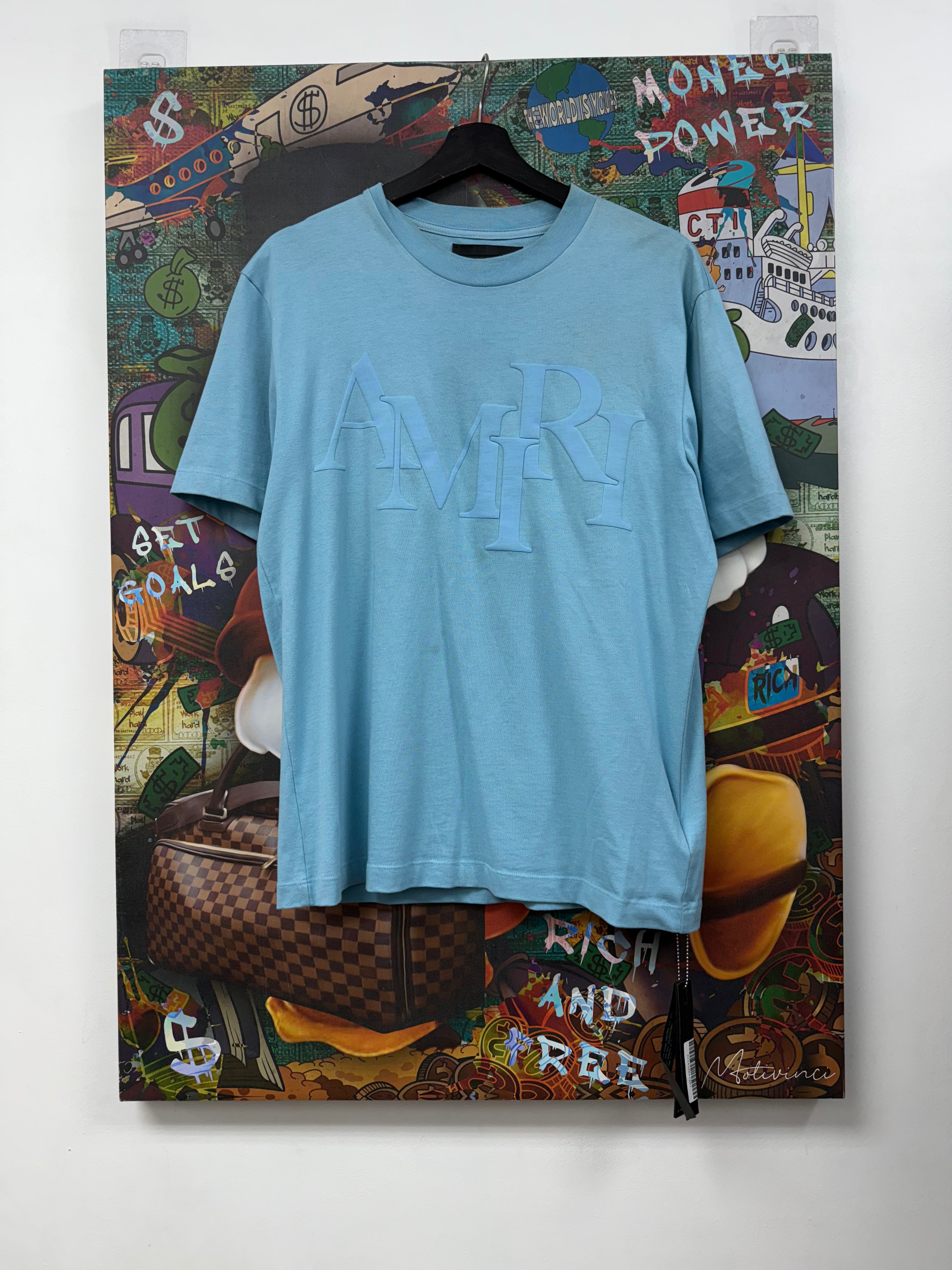 Amiri Staggered Baby Blue Logo Tee