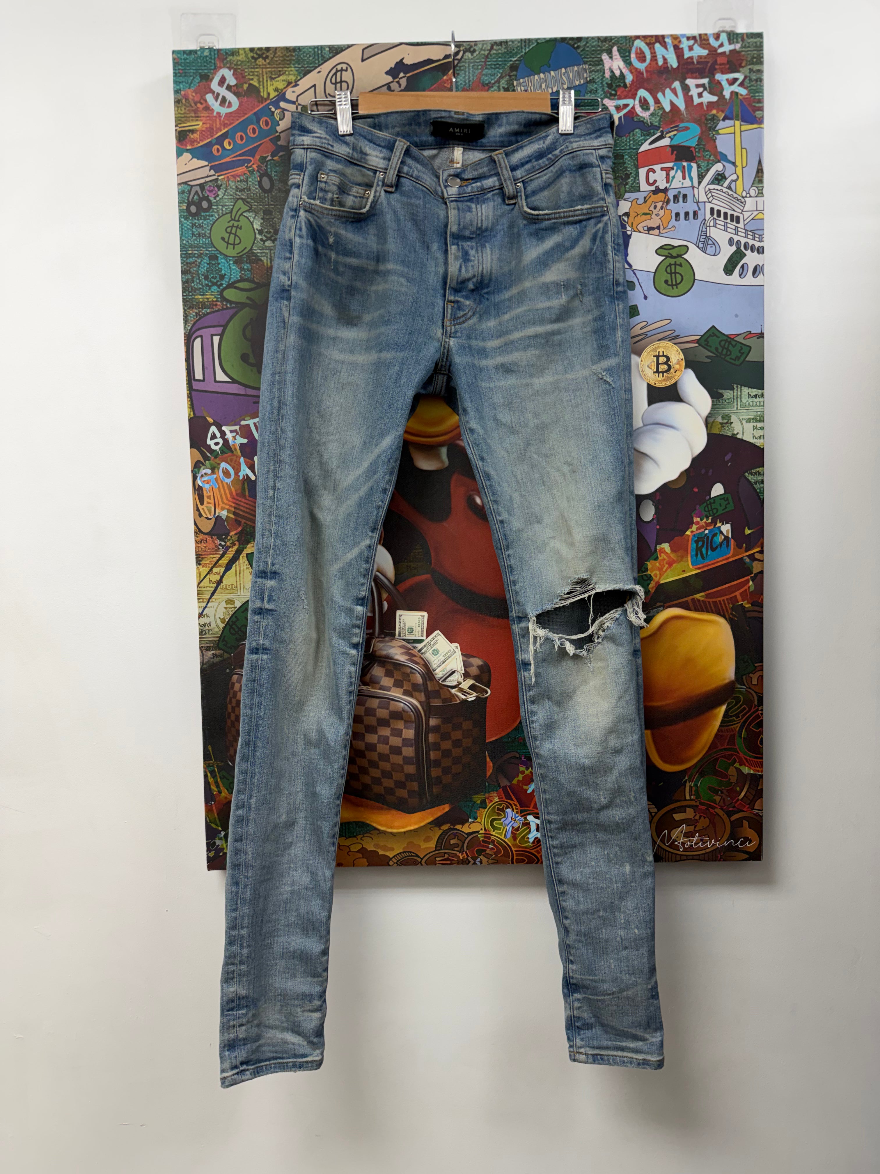 Amiri Light Wash Knee Rip Jeans