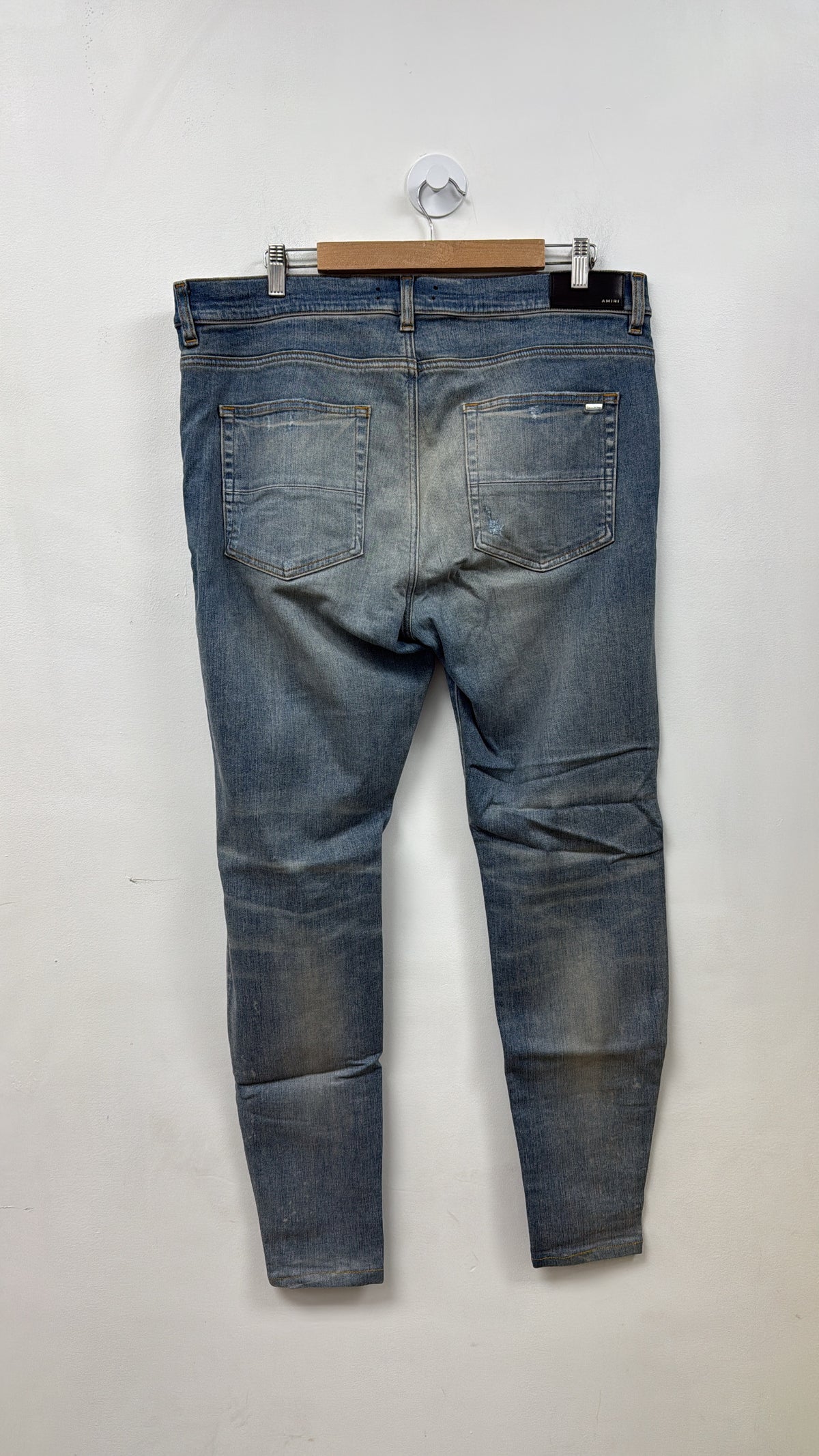 Amiri Light Wash Knee Rip Jeans