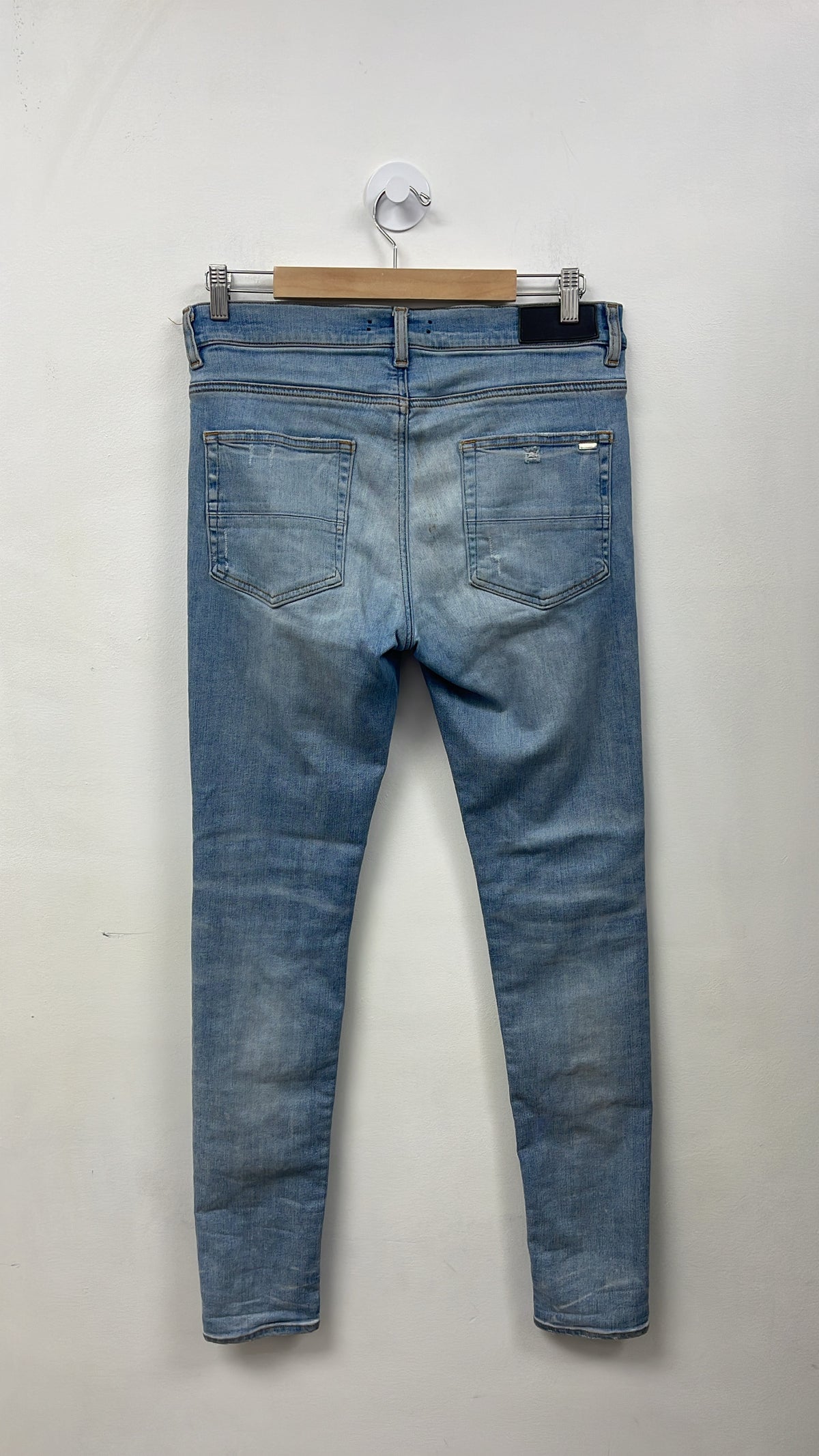 Amiri MX1 Light Wash White Patch Jeans