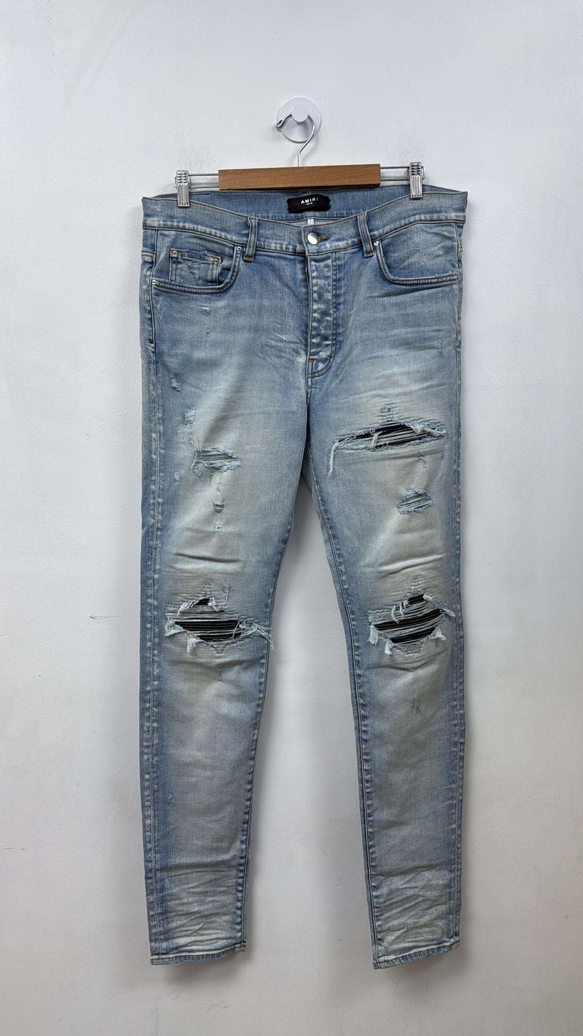 Amiri MX1 Light Wash Camo Patch Jeans