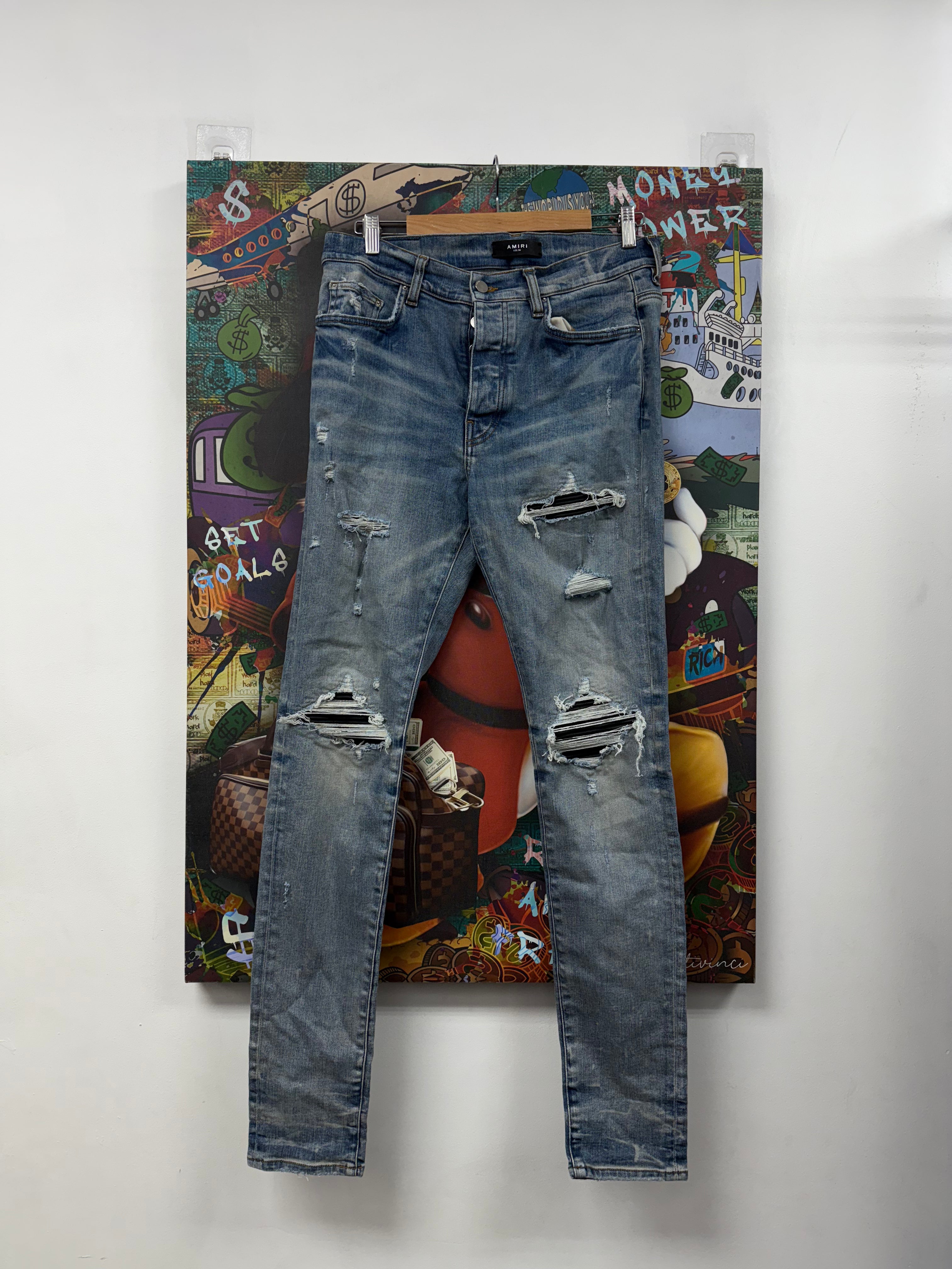 Amiri Light Wash Black Patch MX1 Jeans