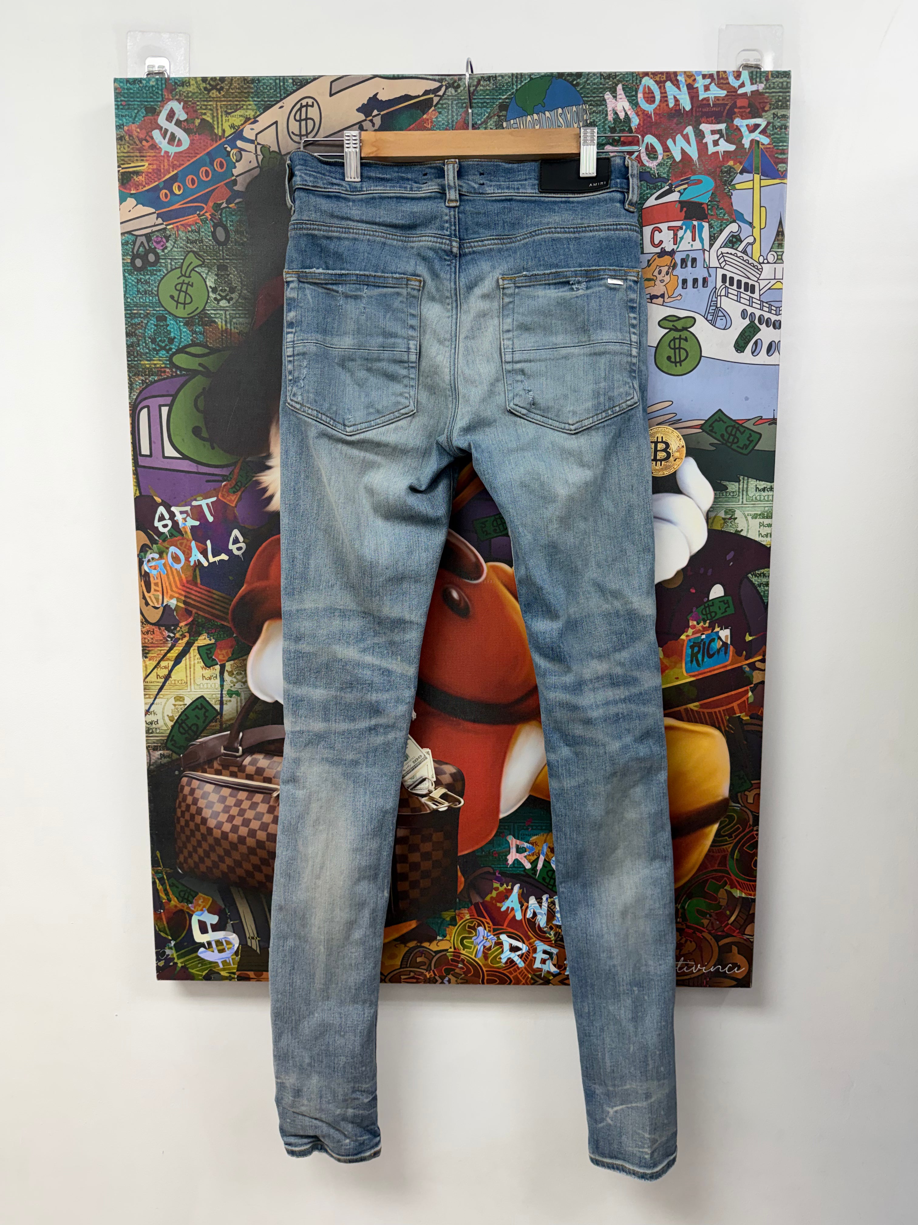 Amiri MX1 Light Wash Red Patch Jeans