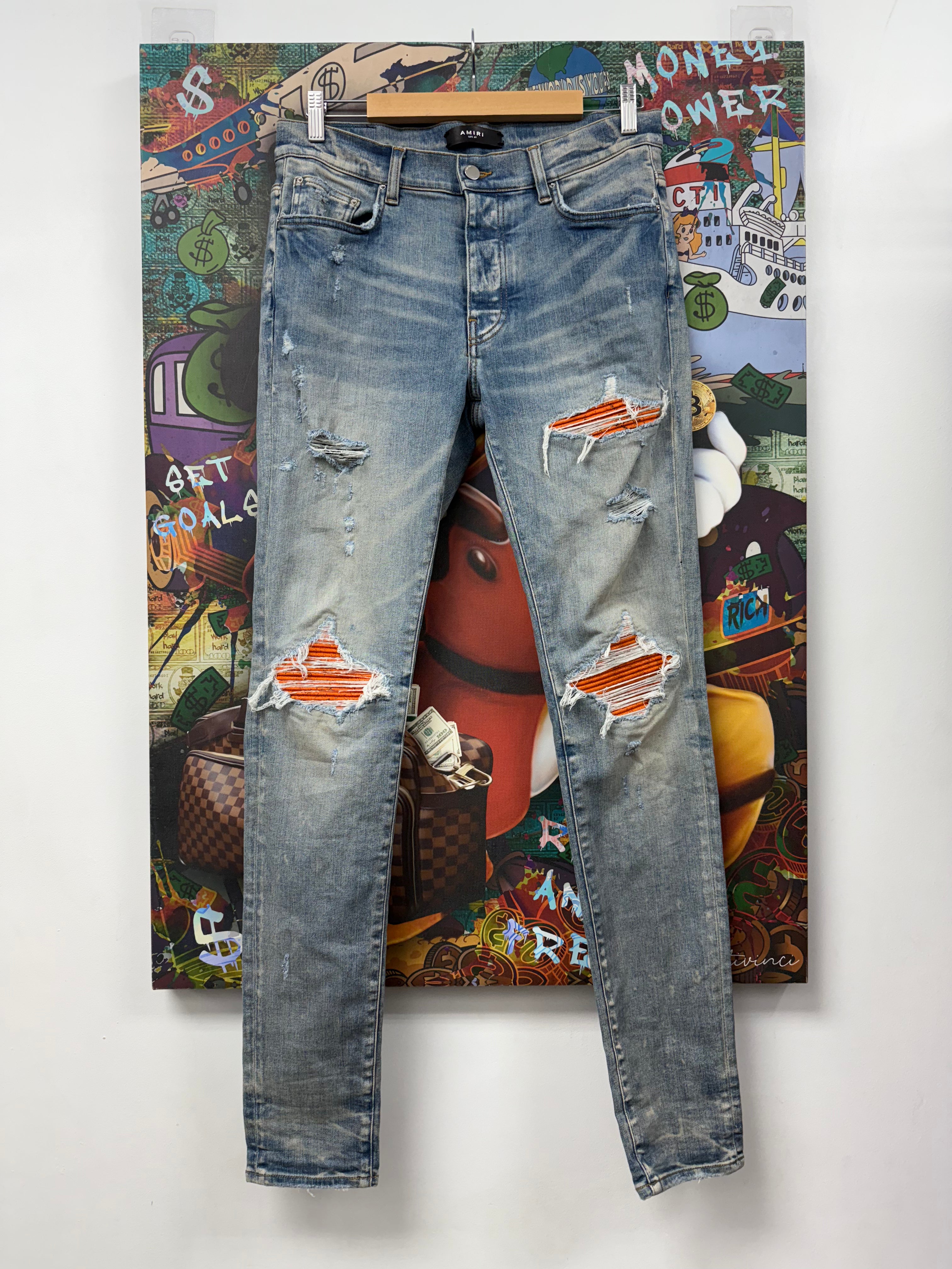 Amiri MX1 Light Wash Orange Crackle Jeans