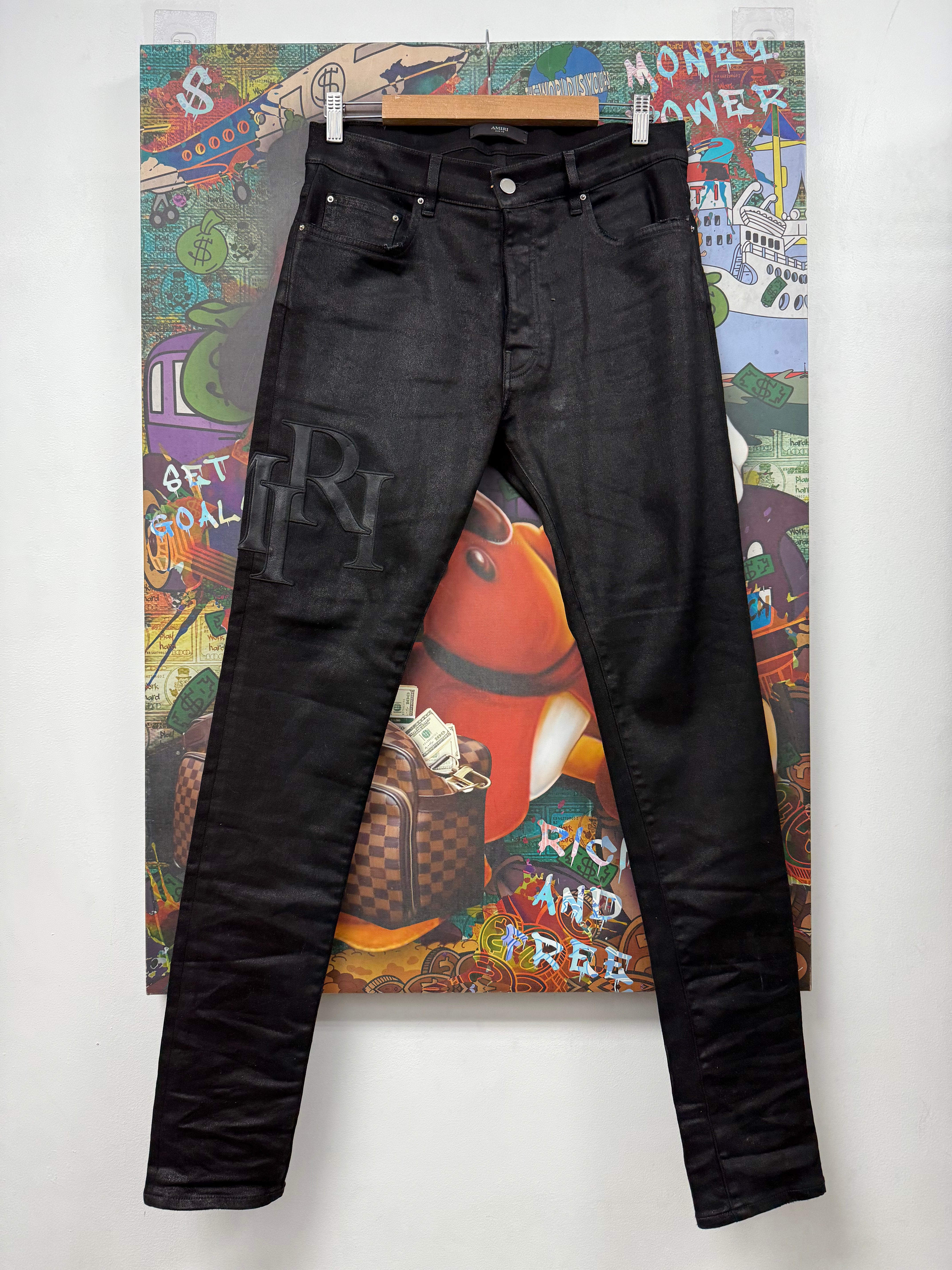 Amiri Black Waxed Staggered Side Logo Jeans