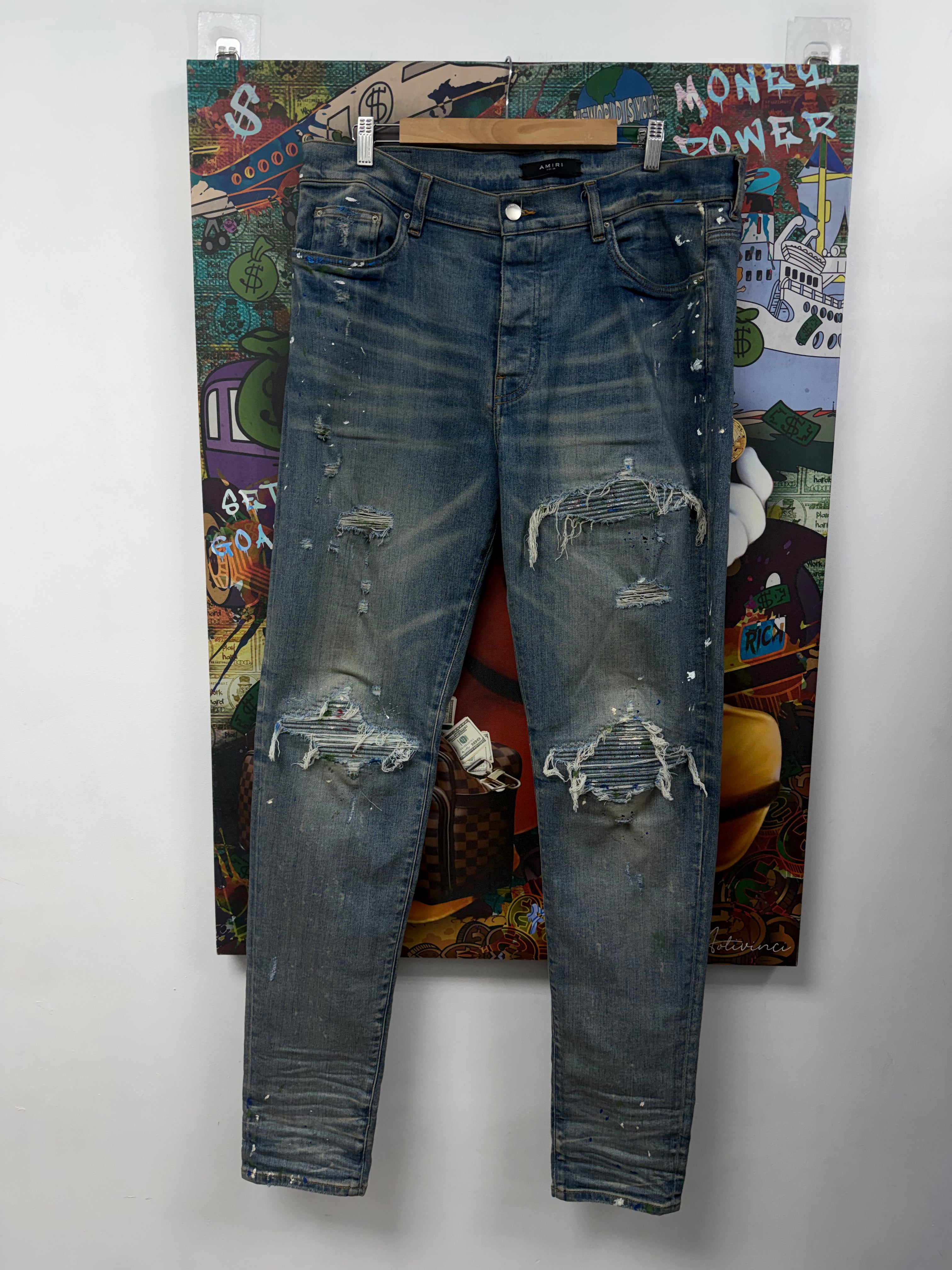 Amiri MX1 Light Wash Denim Splatter Patch Jeans