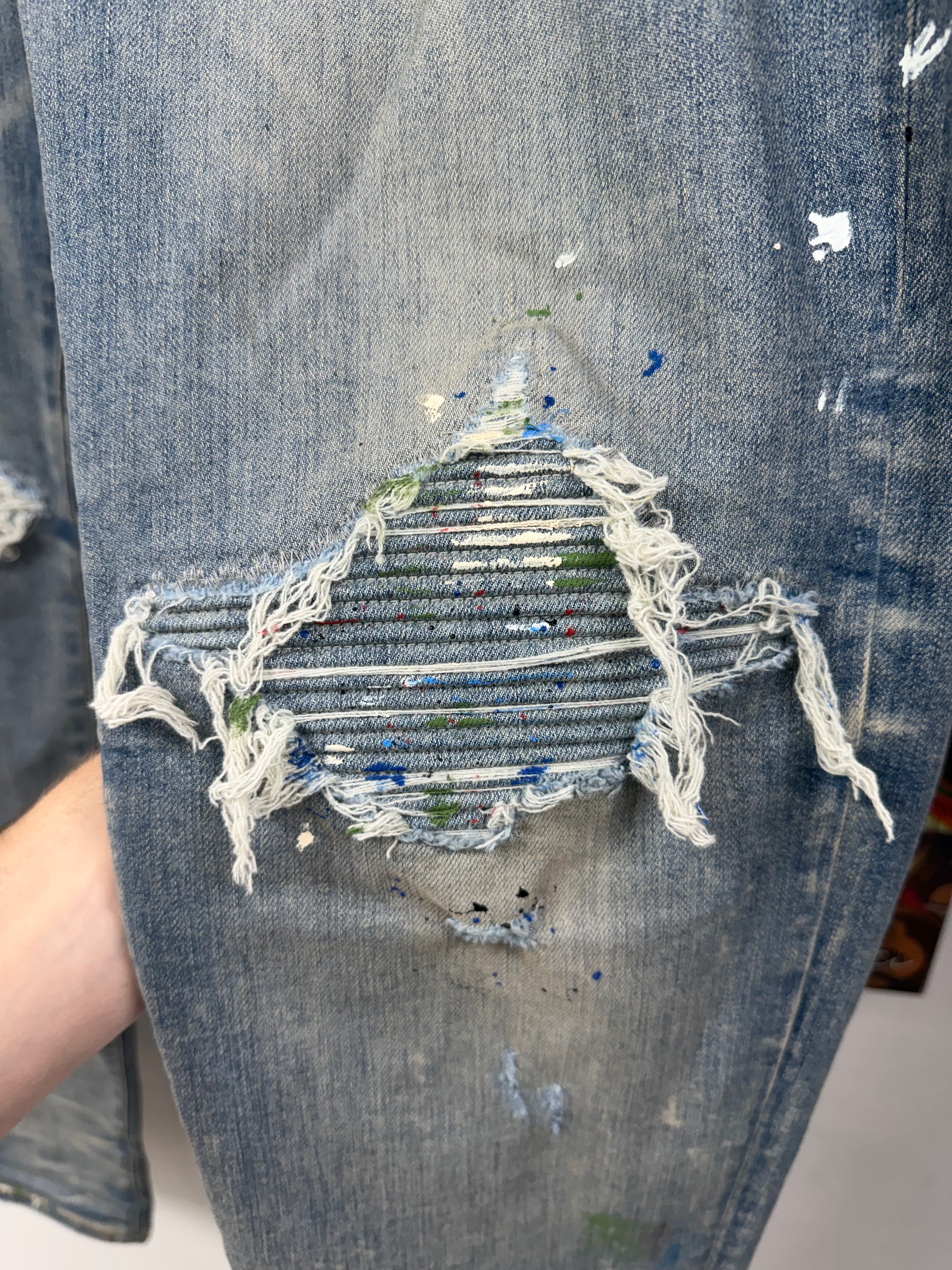 Amiri MX1 Light Wash Denim Splatter Patch Jeans