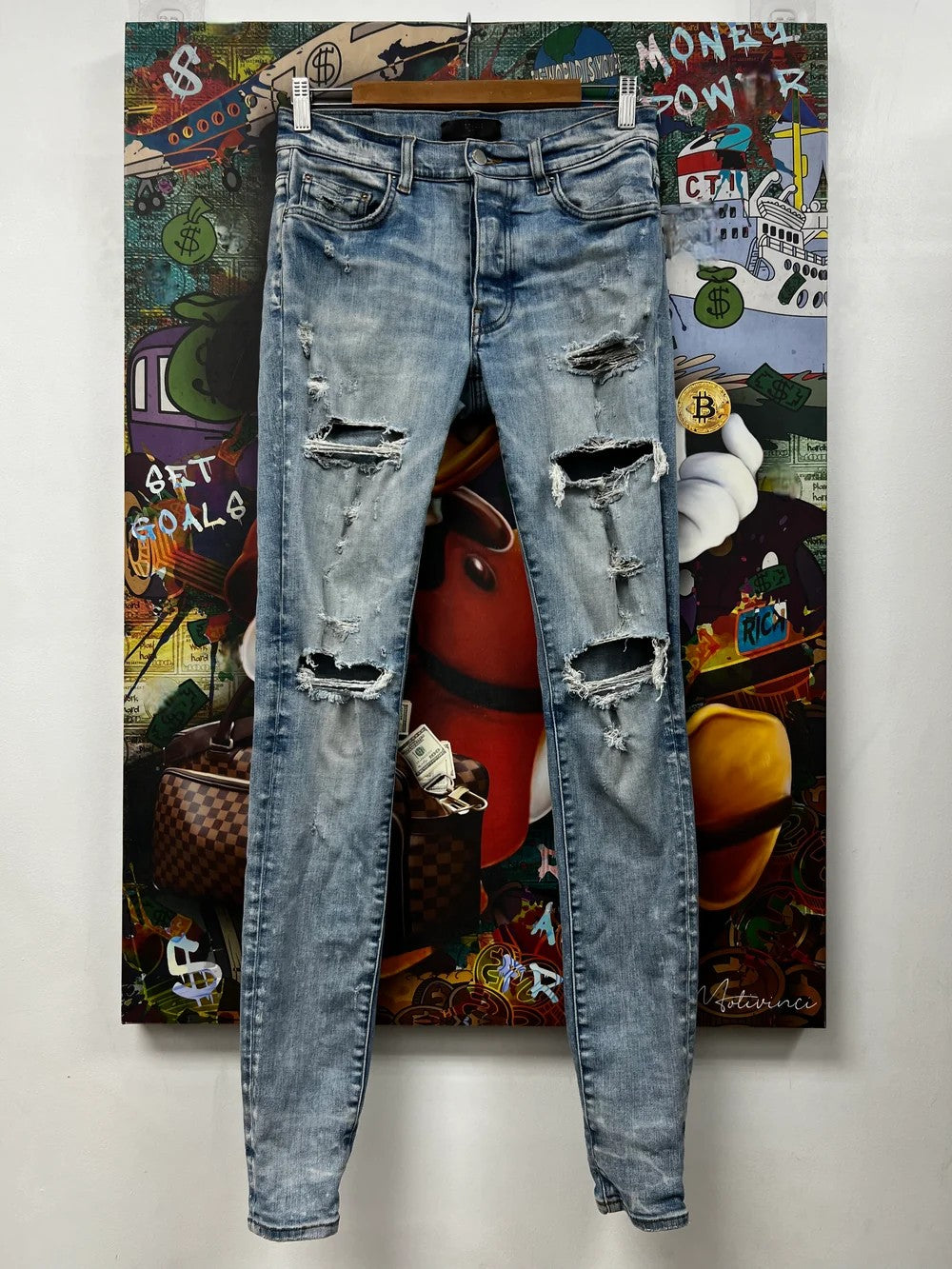Amiri Ripped Thrasher Light Wash Jeans