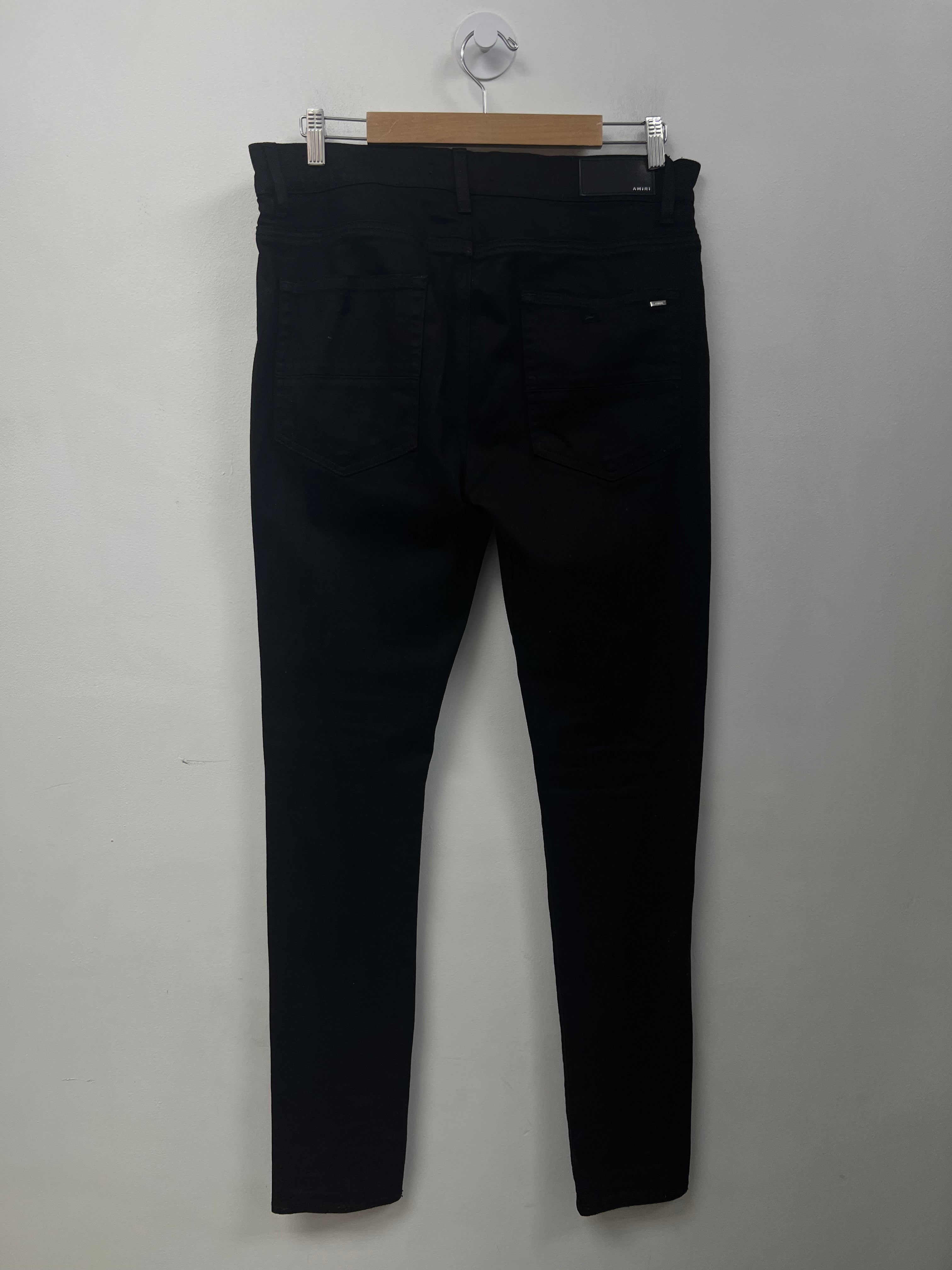 Amiri Black Ripped Thrasher Jeans