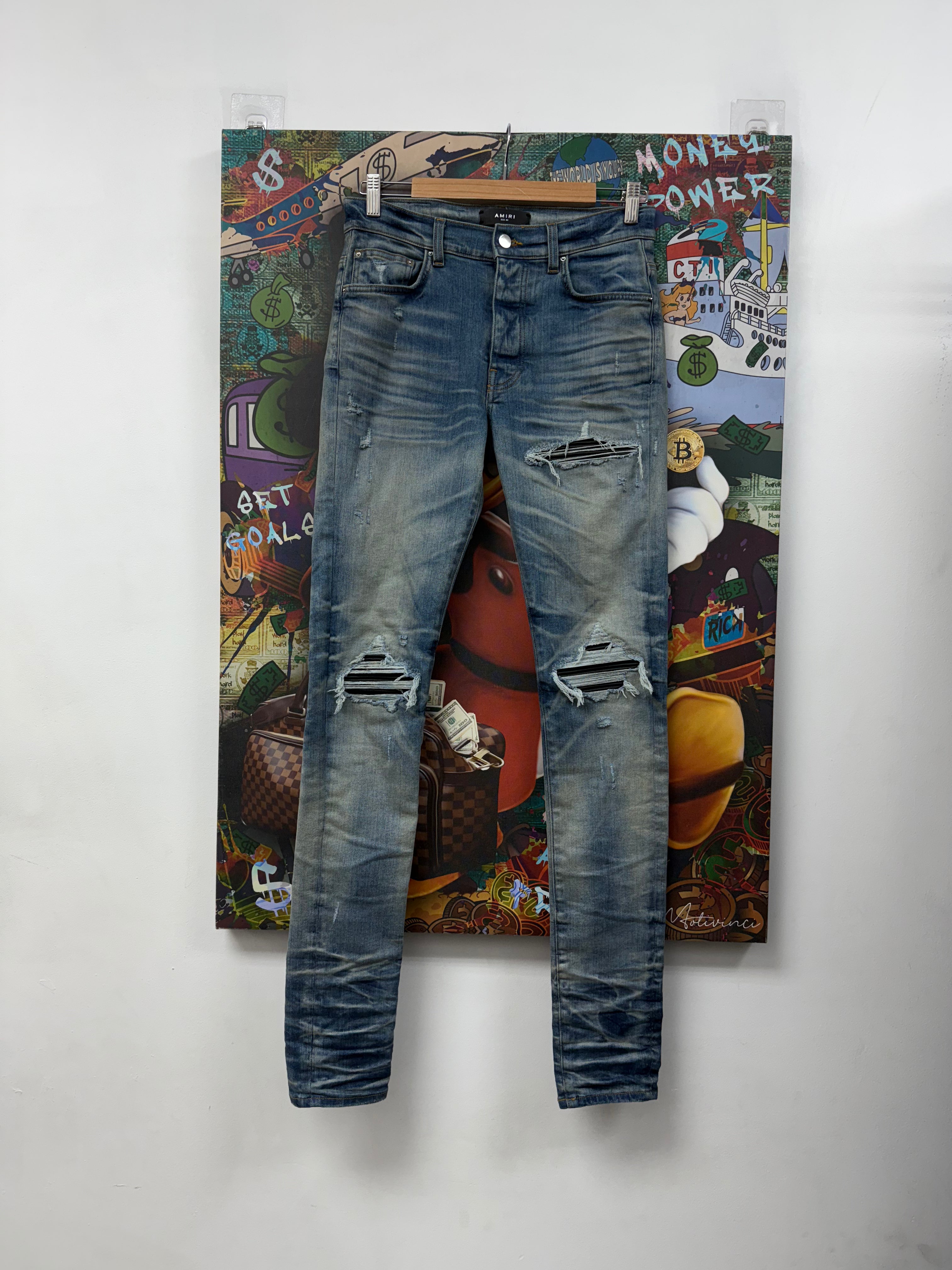 Amiri MX1 Light Wash Black Patch Jeans