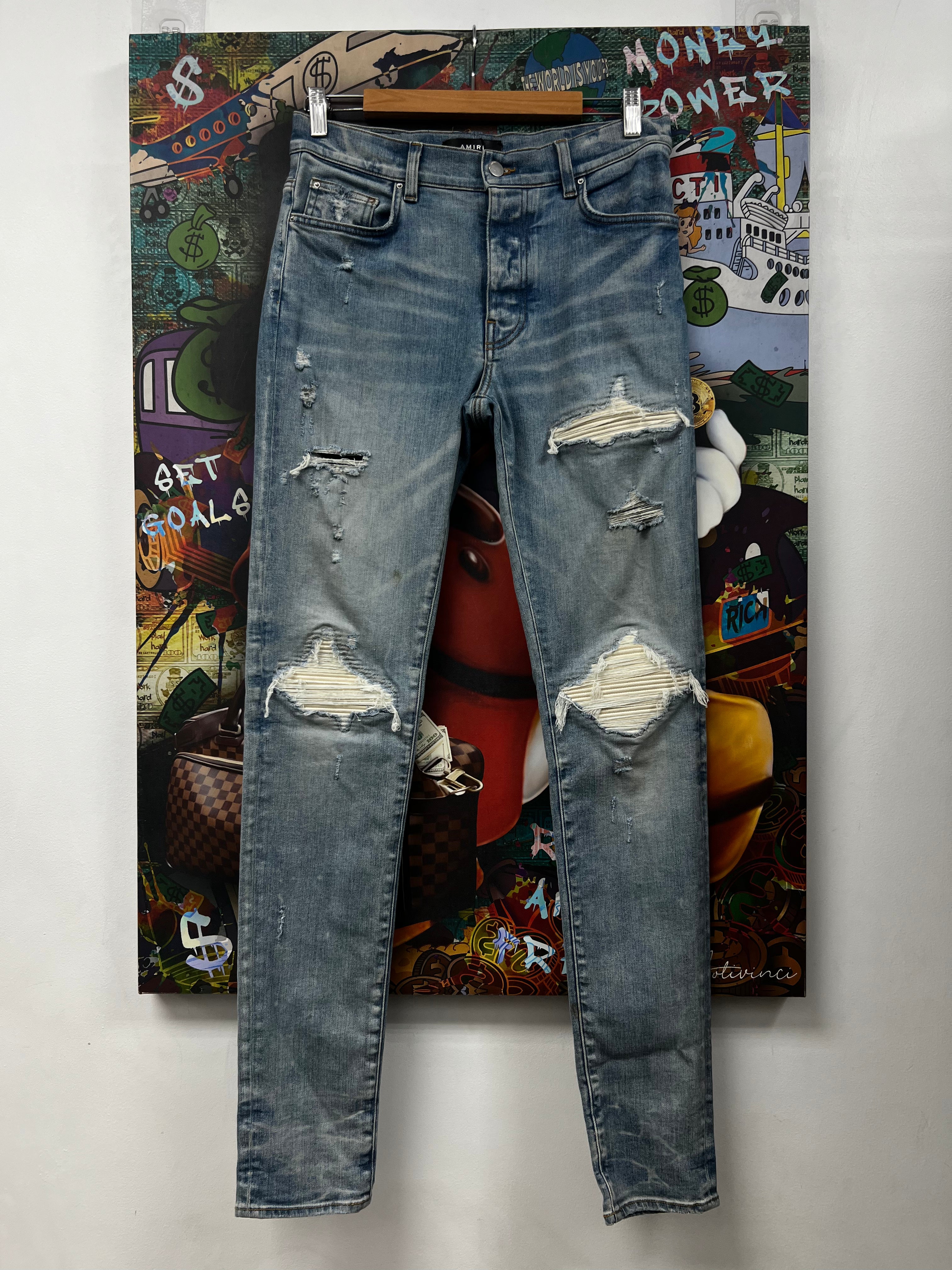 Amiri Mx1 Light Wash White Patch Jeans