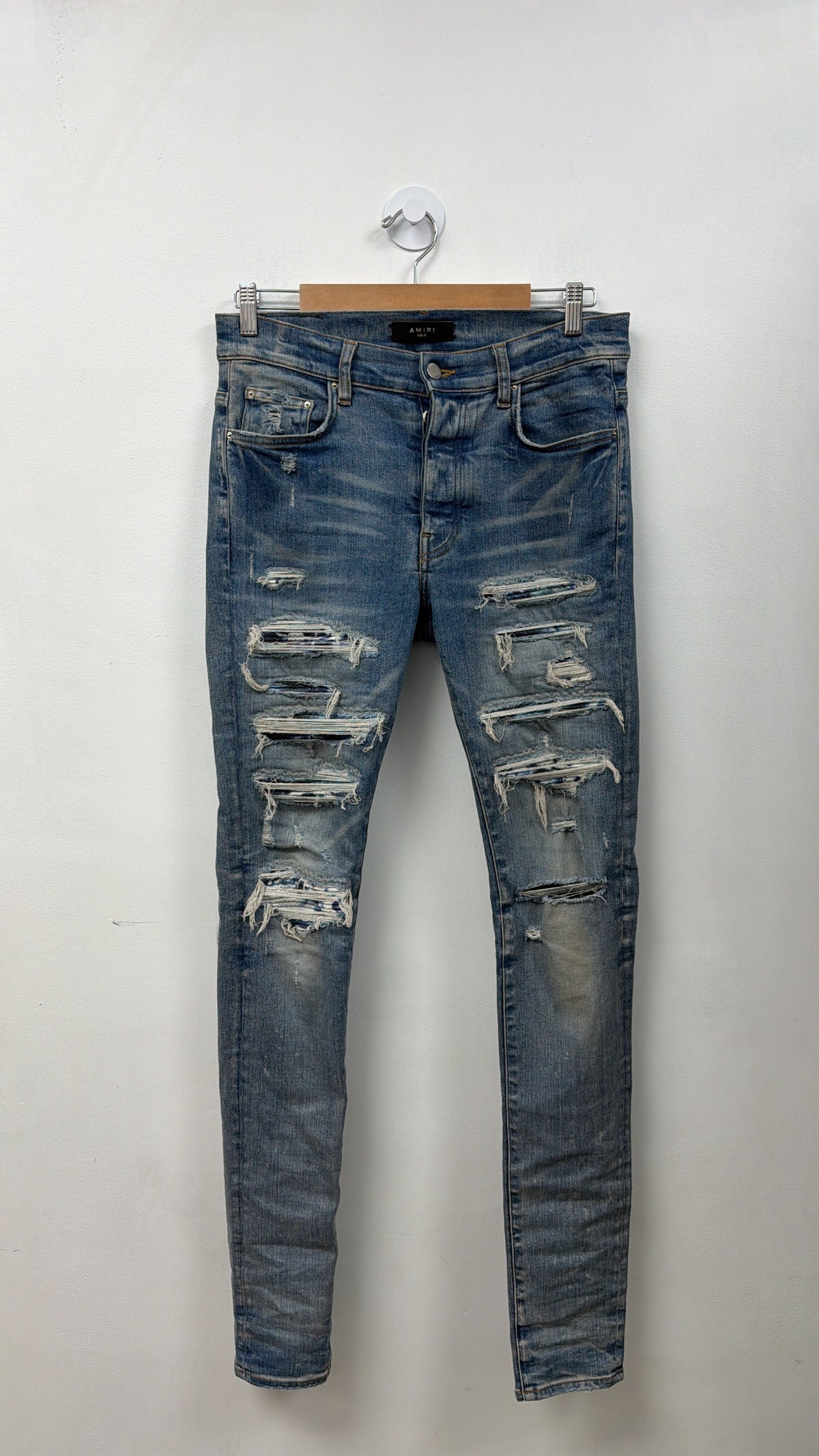 Amiri Light Wash Blue Tie Dye Thrasher Patch Jeans