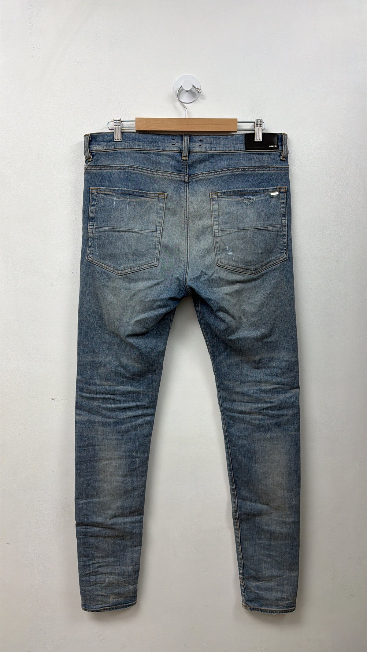 Amiri MX1 Light Wash Black Leather Patch Jeans