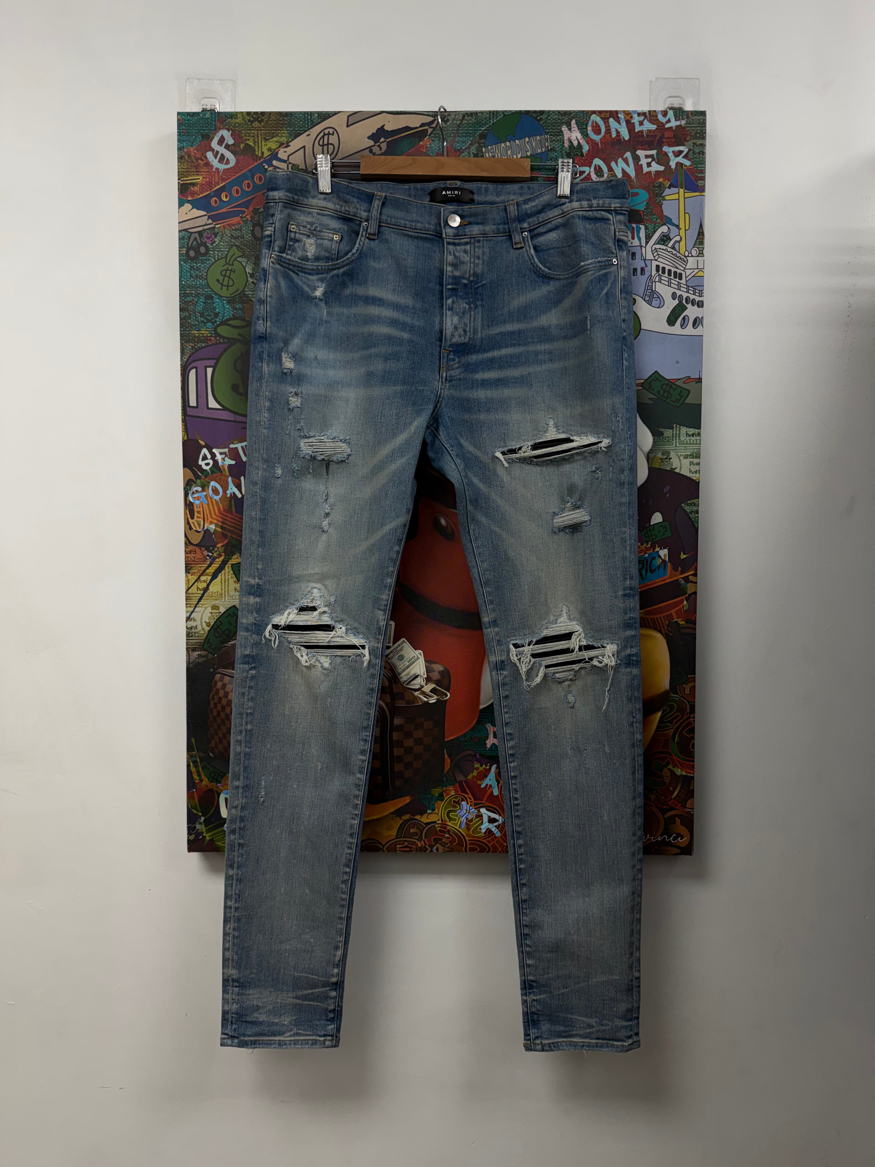 Amiri MX1 Light Wash Black Patch Jeans
