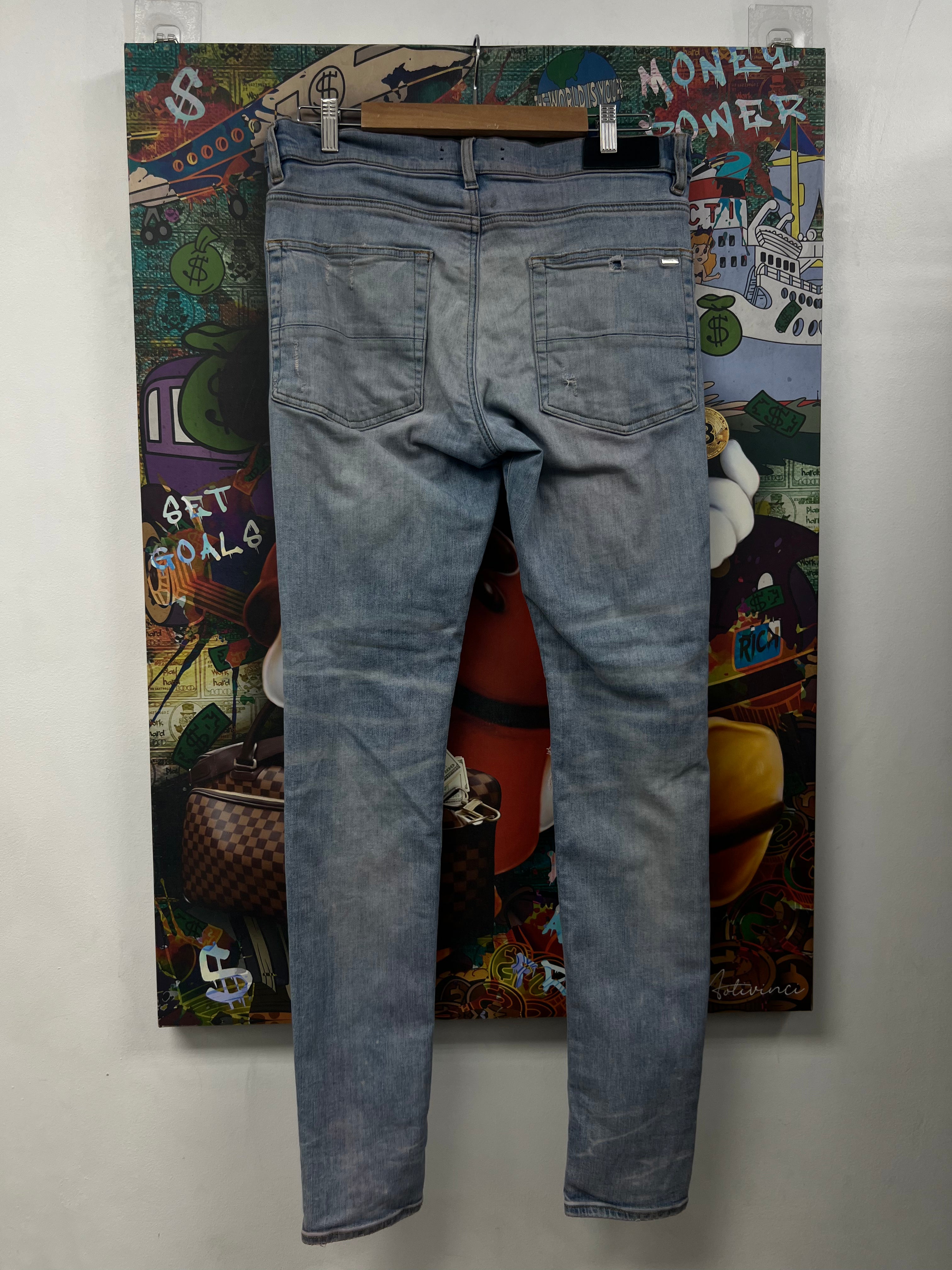 Amiri MX1 Light Wash White Ultra Suede Patch Jeans